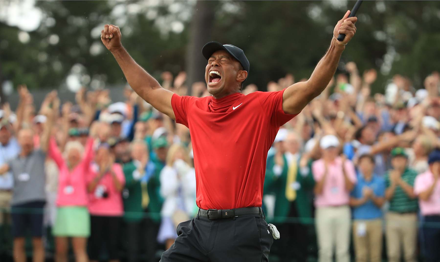 AUGUSTA, GEORGIA - APRIL 14: Tiger Woods (L) of the United States celebrates on the 18th green after winning the Masters at Augusta National Golf Club on April 14, 2019 in Augusta, Georgia. (Photo by Andrew Redington/Getty Images)