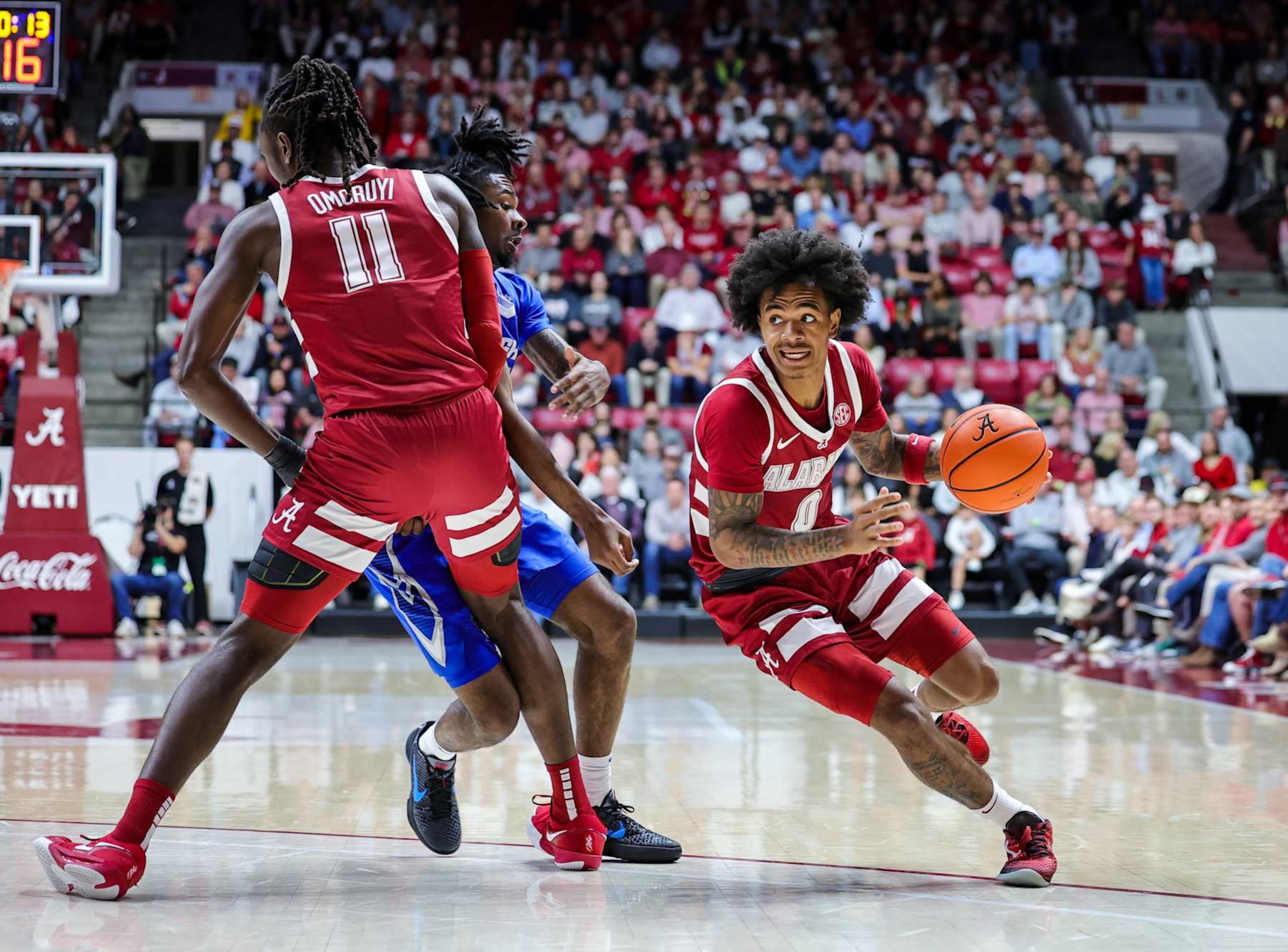 TUSCALOOSA, ALABAMA - DECEMBER 14: Labaron Philon #0 drives around the pick from Clifford Omoruyi #11 of the Alabama Crimson Tide of a Creighton Bluejays defender during the first half at Coleman Coliseum on December 14, 2024 in Tuscaloosa, Alabama.  (Photo by Brandon Sumrall/Getty Images)