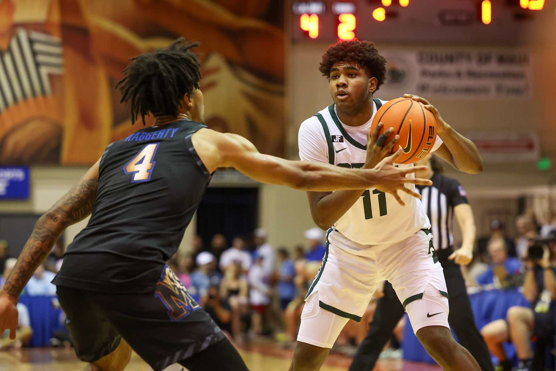 LAHAINA, HAWAII - NOVEMBER 26: Jase Richardson #11 of the Michigan State Spartans looks to pass as he is defended by PJ Haggerty #4 of the Memphis Tigers during the first half of the Maui Invitational at the Lahaina Civic Center on November 26, 2024 in Lahaina, Hawaii. (Photo by Darryl Oumi/Getty Images)