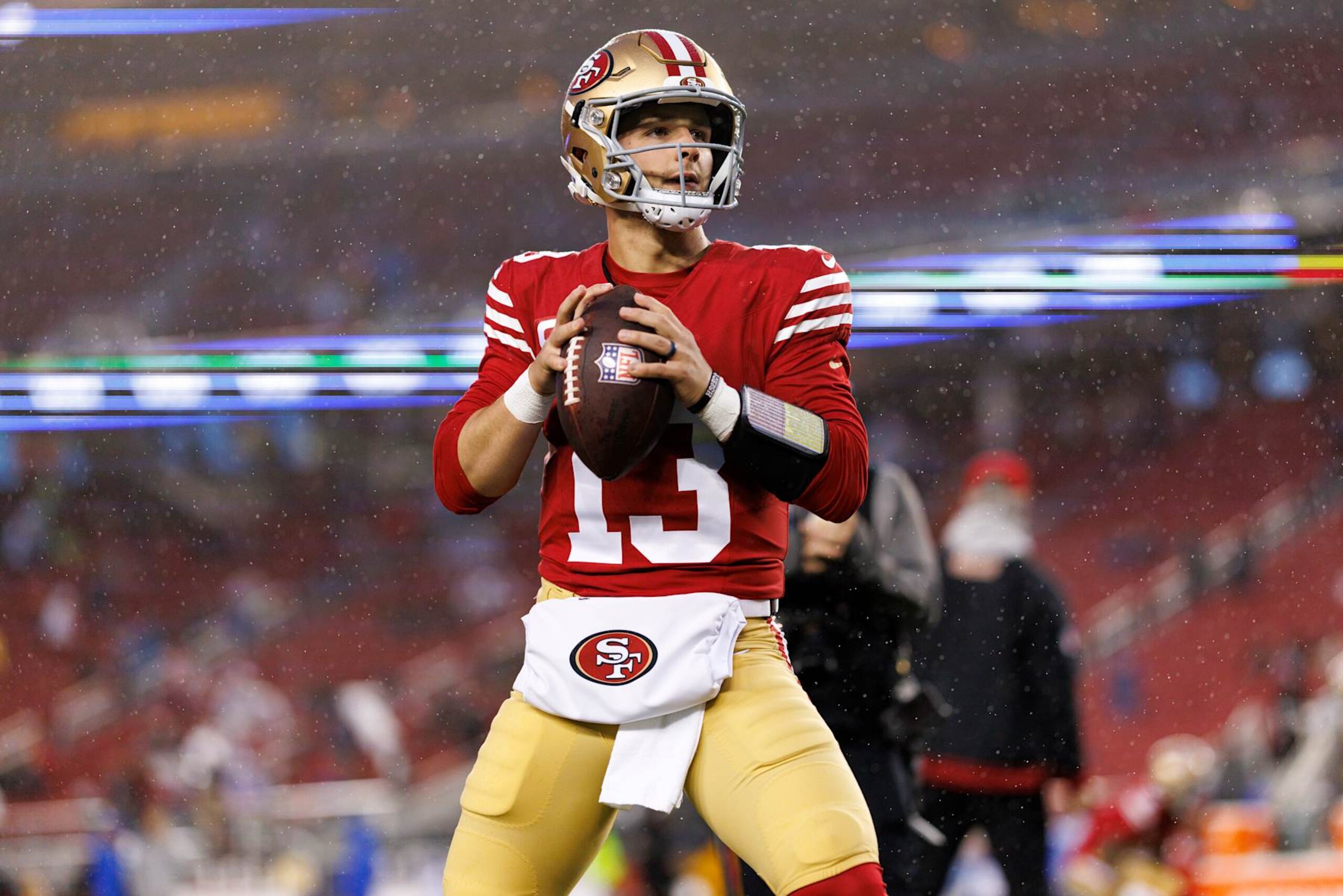 SANTA CLARA, CALIFORNIA - DECEMBER 12: Quarterback Brock Purdy #13 of the San Francisco 49ers warms up prior to an NFL football game against the Los Angeles Rams, at Levi's Stadium on December 12, 2024 in Santa Clara, California. (Photo by Brooke Sutton/Getty Images)
