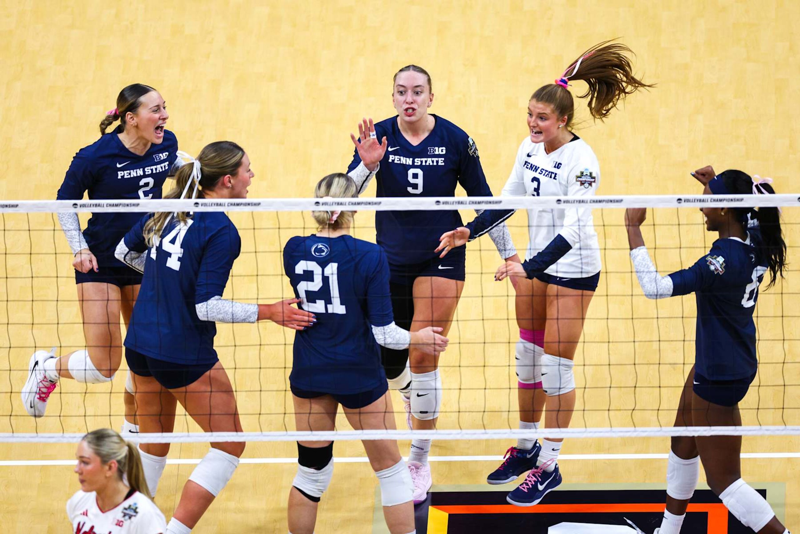 LOUISVILLE, KENTUCKY - DECEMBER 19: The Penn St. Nittany Lions react after a play against the Nebraska Huskers during the Division I Women's Volleyball Semifinals held at the KFC YUM! Center on December 19, 2024 in Louisville, Kentucky. (Photo by Jamie Schwaberow/NCAA Photos via Getty Images)