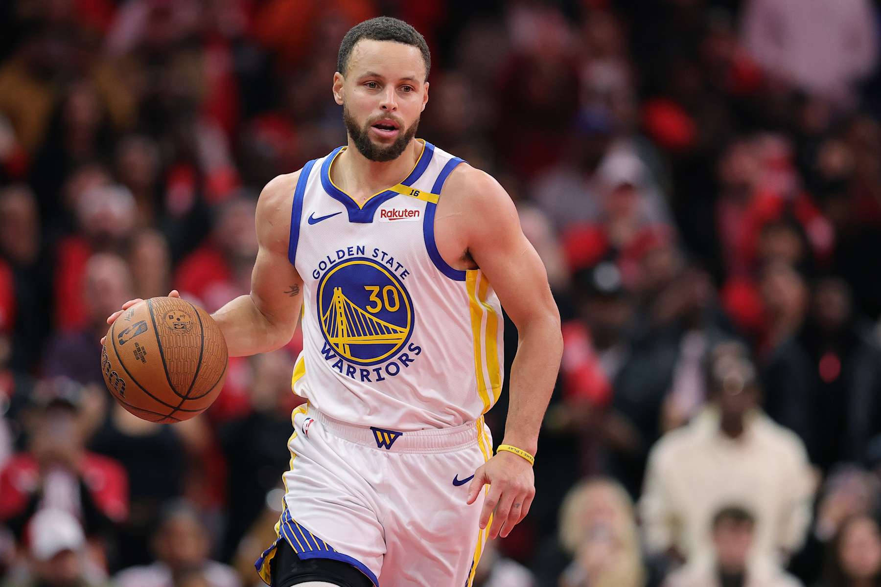 HOUSTON, TEXAS - DECEMBER 11: Stephen Curry #30 of the Golden State Warriors dribbles against the Houston Rockets during the second half of a quarterfinal game in the NBA Emirates Cup at Toyota Center on December 11, 2024 in Houston, Texas. NOTE TO USER: User expressly acknowledges and agrees that, by downloading and or using this photograph, User is consenting to the terms and conditions of the Getty Images License Agreement. (Photo by Alex Slitz/Getty Images)