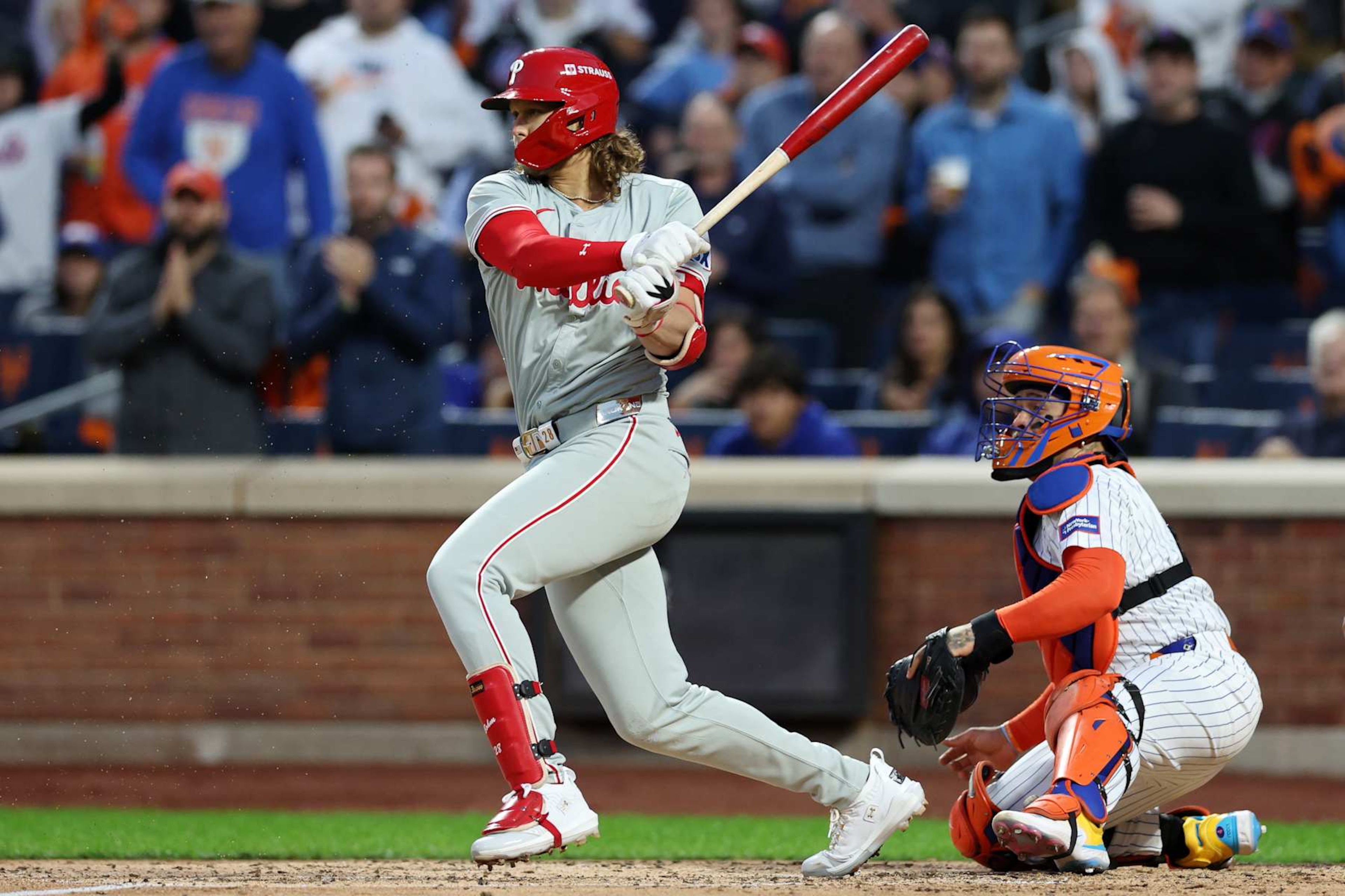 NEW YORK, NEW YORK - OCTOBER 09: Alec Bohm #28 of the Philadelphia Phillies reaches on a fielder's choice in the fourth inning against the New York Mets during Game Four of the Division Series at Citi Field on October 09, 2024 in New York City. (Photo by Elsa/Getty Images)