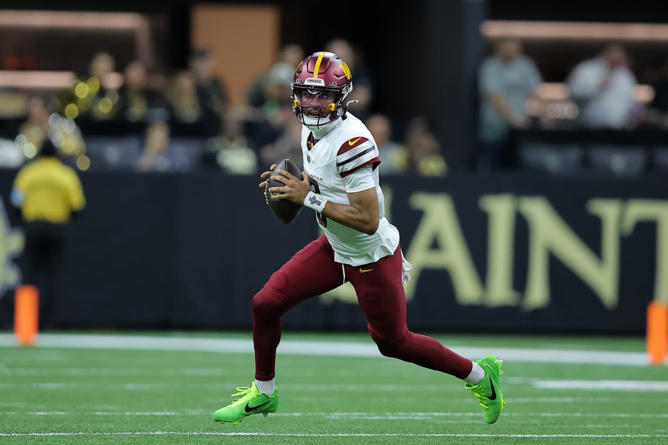 NEW ORLEANS, LOUISIANA - DECEMBER 15: Jayden Daniels #5 of the Washington Commanders throws the ball against the New Orleans Saints during a game at Caesars Superdome on December 15, 2024 in New Orleans, Louisiana. (Photo by Jonathan Bachman/Getty Images)