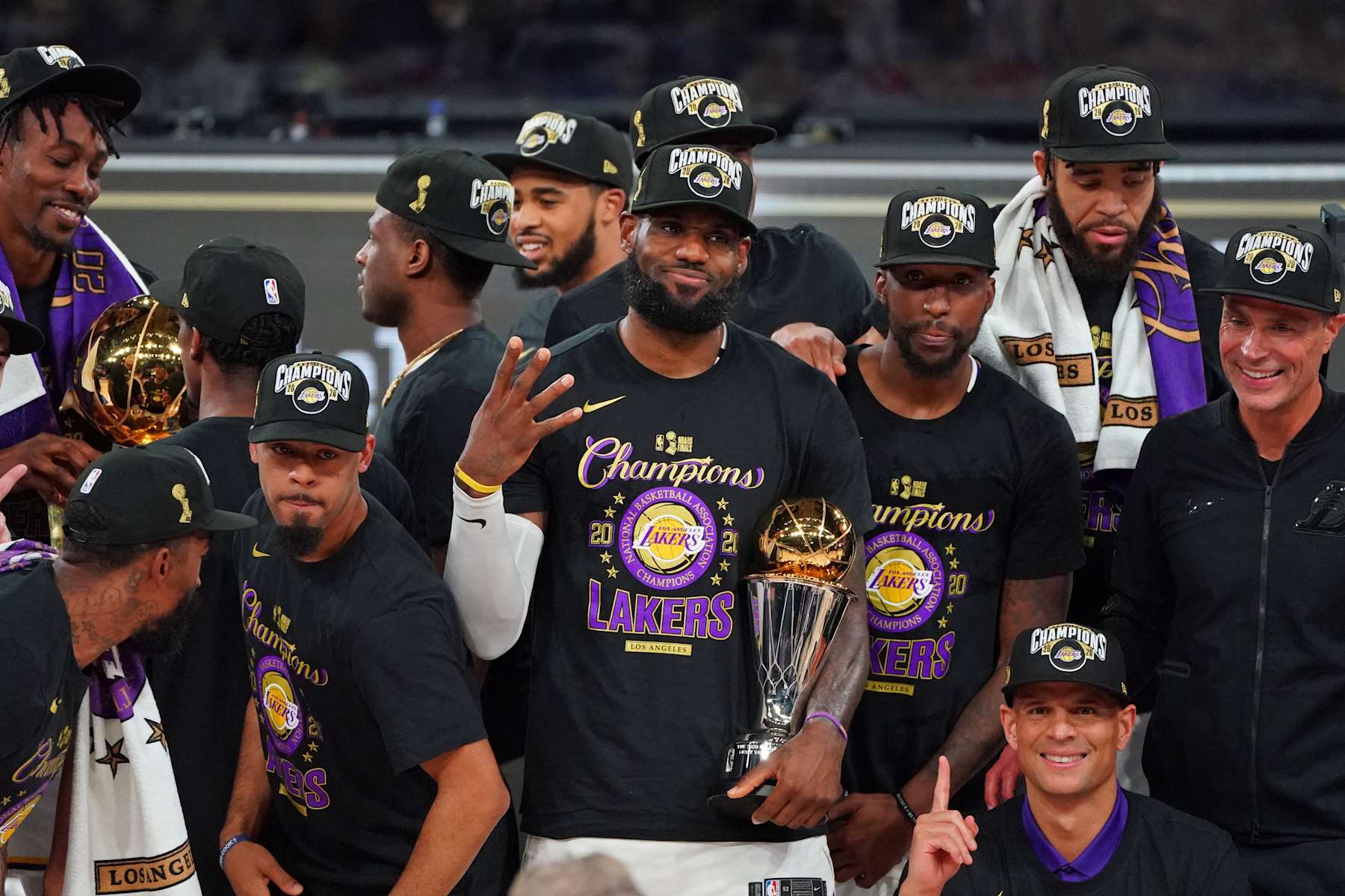 ORLANDO, FL - OCTOBER 11: LeBron James #23 of the Los Angeles Lakers celebrates with the Bill Russell Finals MVP Trophy on court after winning Game Six of the NBA Finals against the Miami Heat on October 11, 2020 in Orlando, Florida at AdventHealth Arena. NOTE TO USER: User expressly acknowledges and agrees that, by downloading and/or using this Photograph, user is consenting to the terms and conditions of the Getty Images License Agreement. Mandatory Copyright Notice: Copyright 2020 NBAE (Photo by Jesse D. Garrabrant/NBAE via Getty Images)