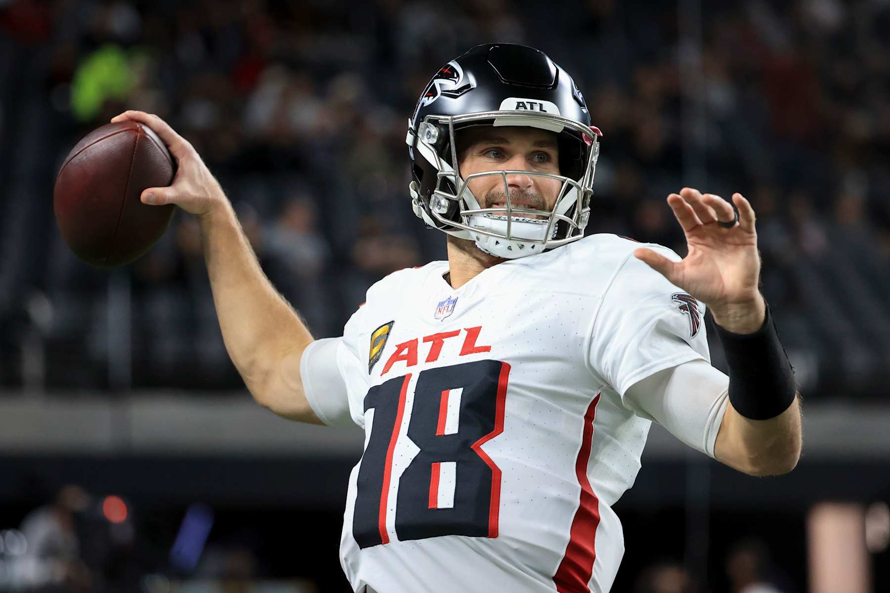LAS VEGAS, NEVADA - DECEMBER 16: Kirk Cousins #18 of the Atlanta Falcons warms up prior to a game against the Las Vegas Raiders at Allegiant Stadium on December 16, 2024 in Las Vegas, Nevada. (Photo by Ian Maule/Getty Images)