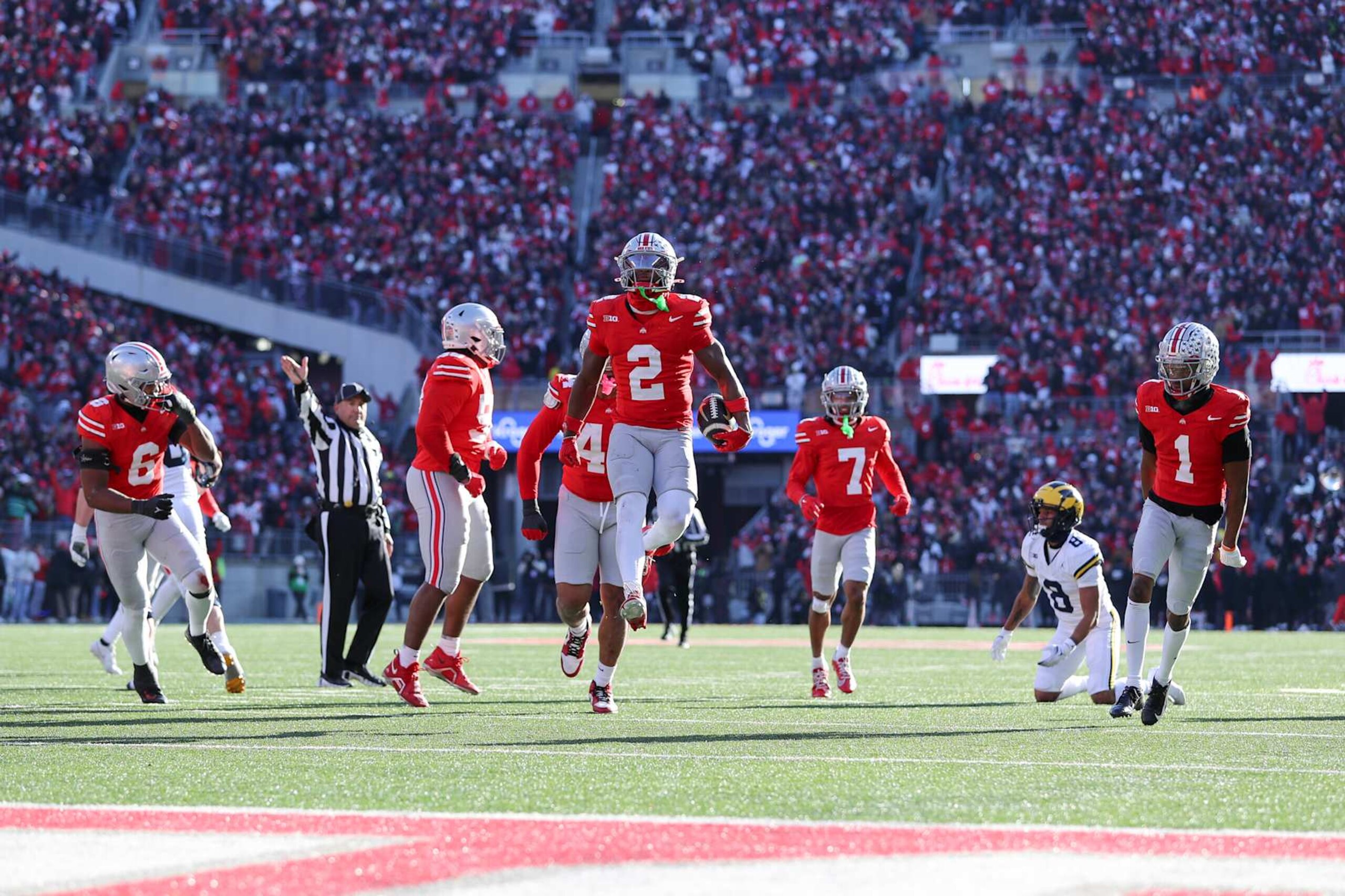 COLUMBUS, OH - NOVEMBER 30: Ohio State Buckeyes safety Caleb Downs (2) reacts with his teammates after an interception during the game against the Michigan Wolverines and the Ohio State Buckeyes on November 30, 2024, at Ohio Stadium in Columbus, OH. (Photo by Ian Johnson/Icon Sportswire via Getty Images)