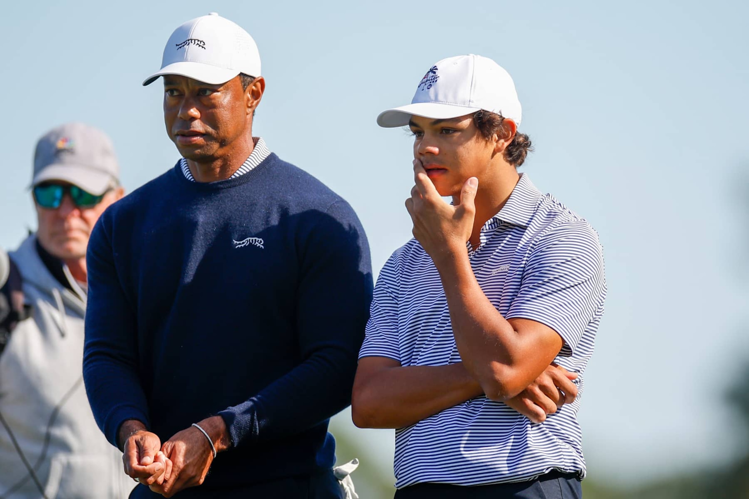 ORLANDO, FLORIDA - DECEMBER 21: Tiger Woods talks with his son Charlie Woods while they play the second hole during the first round of the PNC Championship at Ritz-Carlton Golf Club on December 21, 2024 in Orlando, Florida. (Photo by Mike Ehrmann/Getty Images)