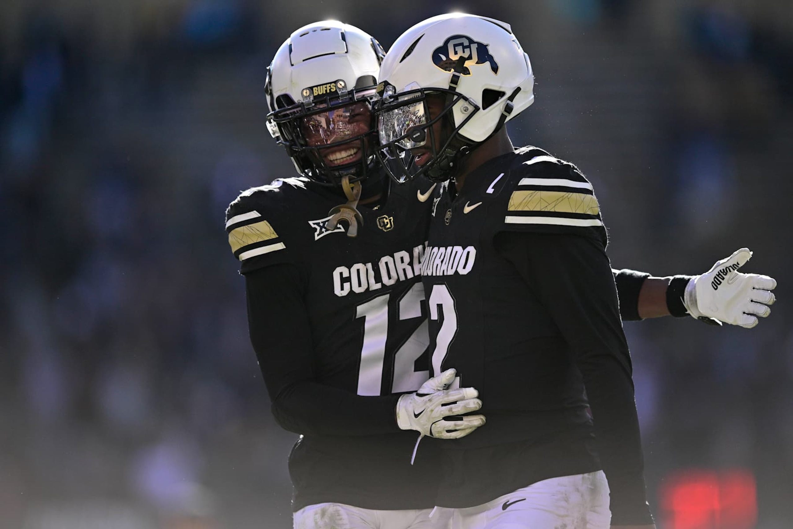 BOULDER, CO - NOVEMBER 29:  Shedeur Sanders #2 and Travis Hunter #12 of the Colorado Buffaloes celebrate after a third quarter touchdown against the Oklahoma State Cowboys at Folsom Field on November 29, 2024 in Boulder, Colorado. (Photo by Dustin Bradford/Getty Images)
