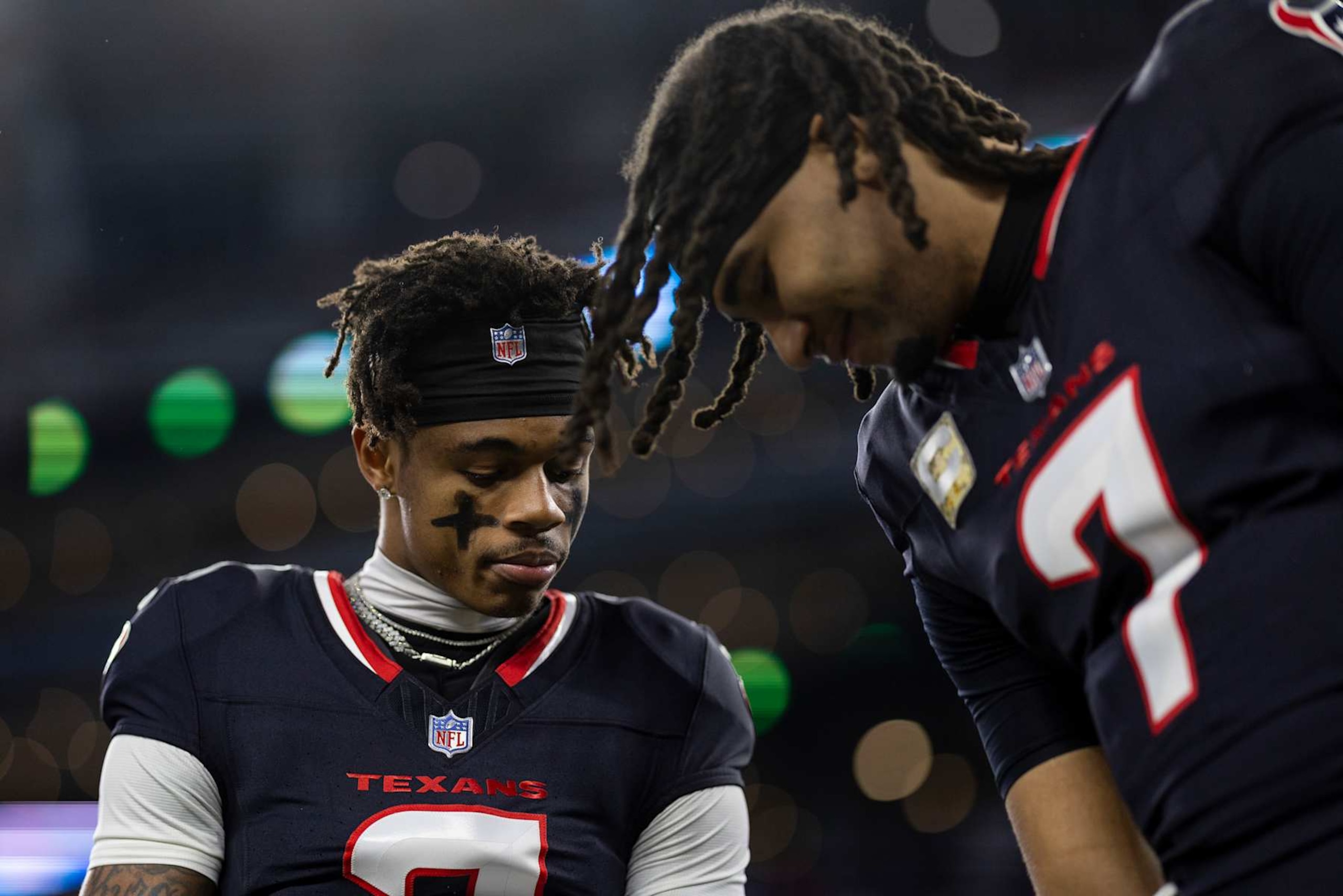 ARLINGTON, TEXAS - NOVEMBER 18: Tank Dell #3 of the Houston Texans and C.J. Stroud #7 of the Houston Texans share a moment during an NFL Football game against the Dallas Cowboys at AT&T Stadium on November 18, 2024 in Arlington, Texas. (Photo by Michael Owens/Getty Images)