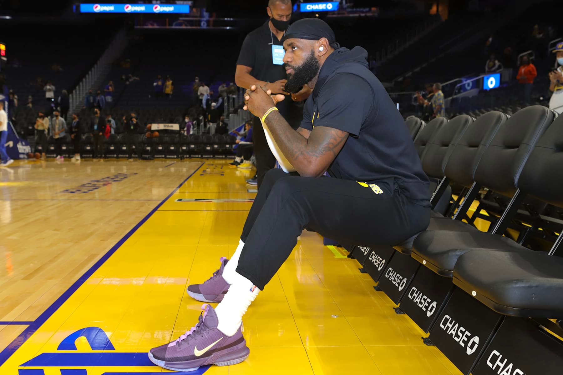 SAN FRANCISCO, CA - OCTOBER 8: LeBron James #6 of the Los Angeles Lakers looks on from the bench before the game against the Golden State Warriors on October 8, 2021 at Chase Center in San Francisco, California. NOTE TO USER: User expressly acknowledges and agrees that, by downloading and/or using this Photograph, user is consenting to the terms and conditions of the Getty Images License Agreement. Mandatory Copyright Notice: Copyright 2021 NBAE (Photo by Jim Poorten/NBAE via Getty Images)