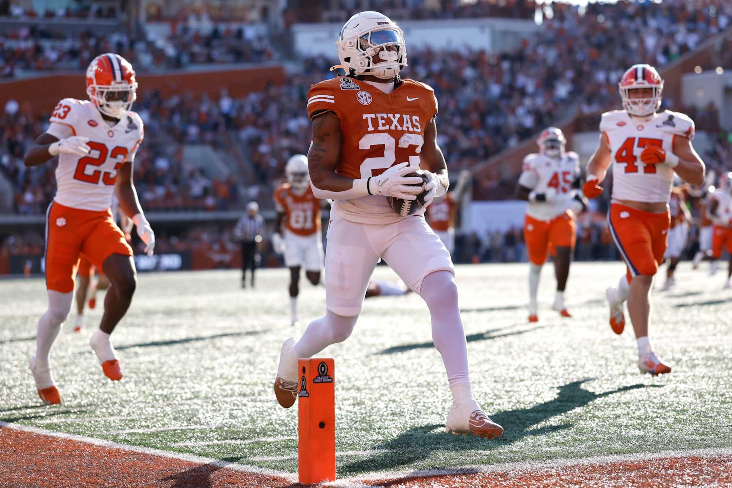 AUSTIN, TEXAS - DECEMBER 21: Jaydon Blue #23 of the Texas Longhorns runs the ball for a touchdown during the second quarter against the Clemson Tigers in the Playoff First Round Game at Darrell K Royal-Texas Memorial Stadium on December 21, 2024 in Austin, Texas. (Photo by Tim Warner/Getty Images) AUSTIN, TEXAS - DECEMBER 21: Jaydon Blue #23 of the Texas Longhorns runs the ball for a touchdown during the second quarter against the Clemson Tigers in the Playoff First Round Game at Darrell K Royal-Texas Memorial Stadium on December 21, 2024 in Austin, Texas. (Photo by Tim Warner/Getty Images)