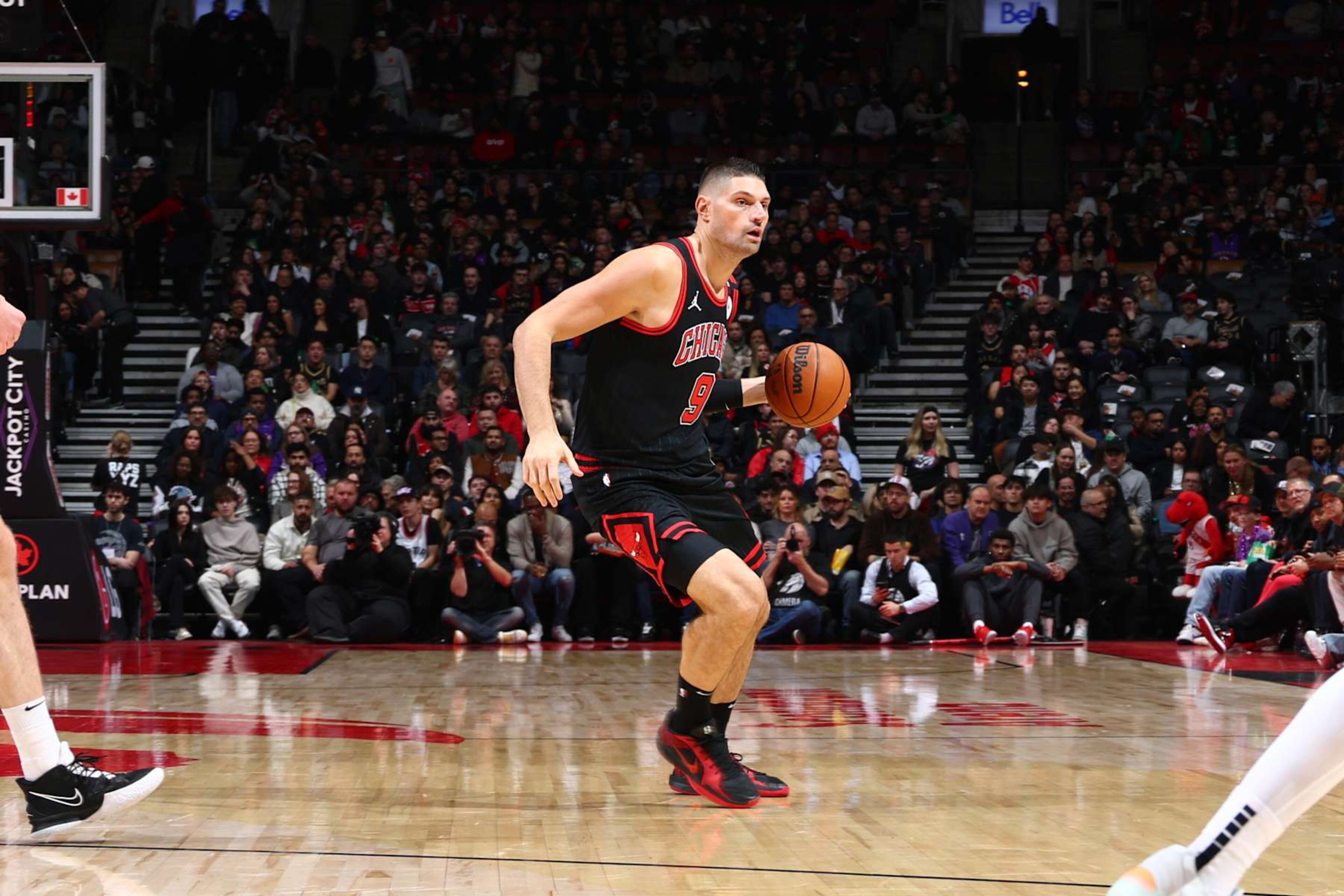 TORONTO, CANADA - DECEMBER 16: Nikola Vucevic #9 of the Chicago Bulls handles the ball during the game against the Toronto Raptors on December 16, 2024 at the Scotiabank Arena in Toronto, Ontario, Canada. NOTE TO USER: User expressly acknowledges and agrees that, by downloading and or using this Photograph, user is consenting to the terms and conditions of the Getty Images License Agreement. Mandatory Copyright Notice: Copyright 2024 NBAE (Photo by Vaughn Ridley/NBAE via Getty Images) TORONTO, CANADA - DECEMBER 16: Nikola Vucevic #9 of the Chicago Bulls handles the ball during the game against the Toronto Raptors on December 16, 2024 at the Scotiabank Arena in Toronto, Ontario, Canada. NOTE TO USER: User expressly acknowledges and agrees that, by downloading and or using this Photograph, user is consenting to the terms and conditions of the Getty Images License Agreement. Mandatory Copyright Notice: Copyright 2024 NBAE (Photo by Vaughn Ridley/NBAE via Getty Images)
