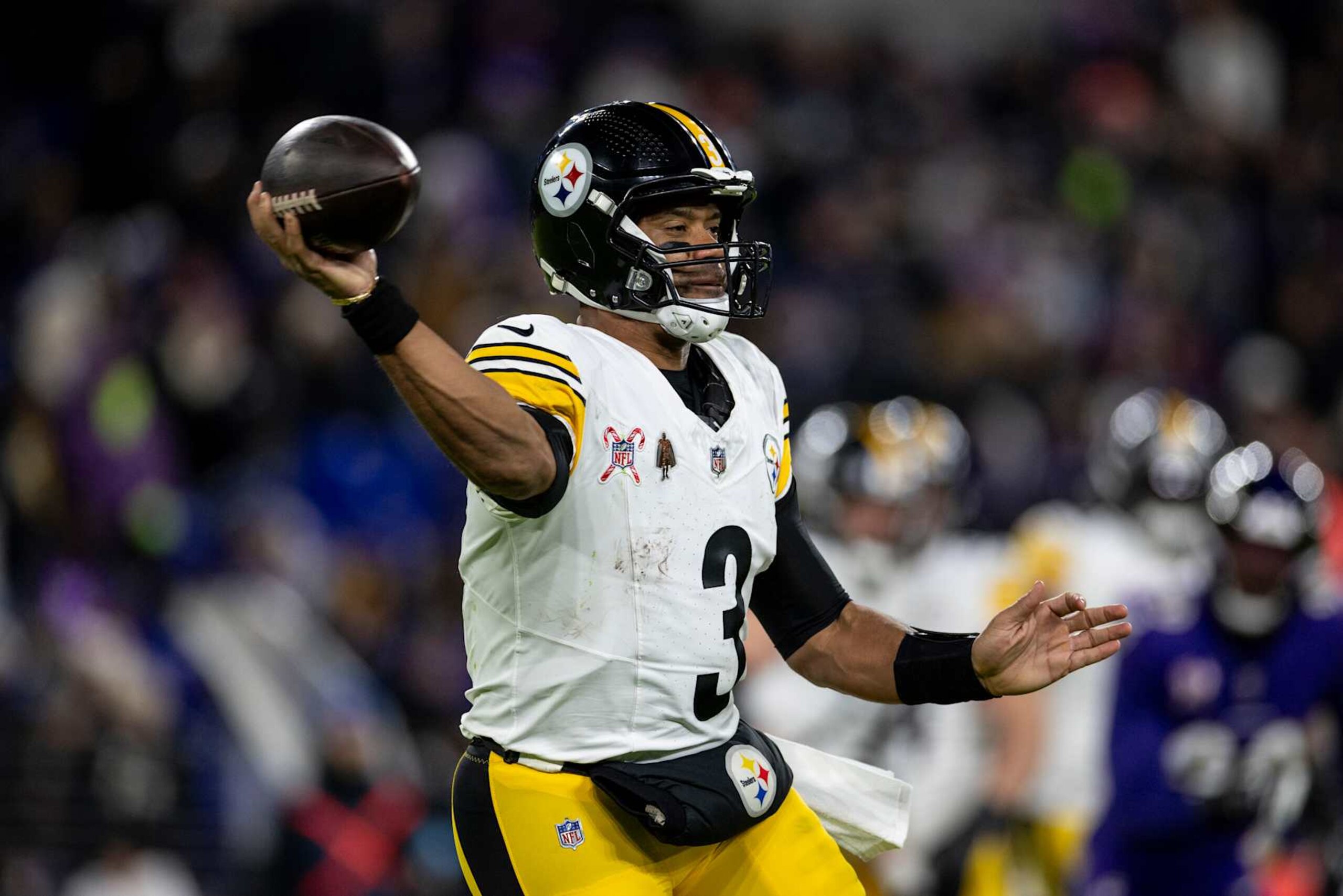 BALTIMORE, MARYLAND - DECEMBER 21: Russell Wilson #3 of the Pittsburgh Steelers looks to pass during an NFL Football game against the Baltimore Ravens at M&T Bank Stadium on December 21, 2024 in Baltimore, Maryland. (Photo by Michael Owens/Getty Images)