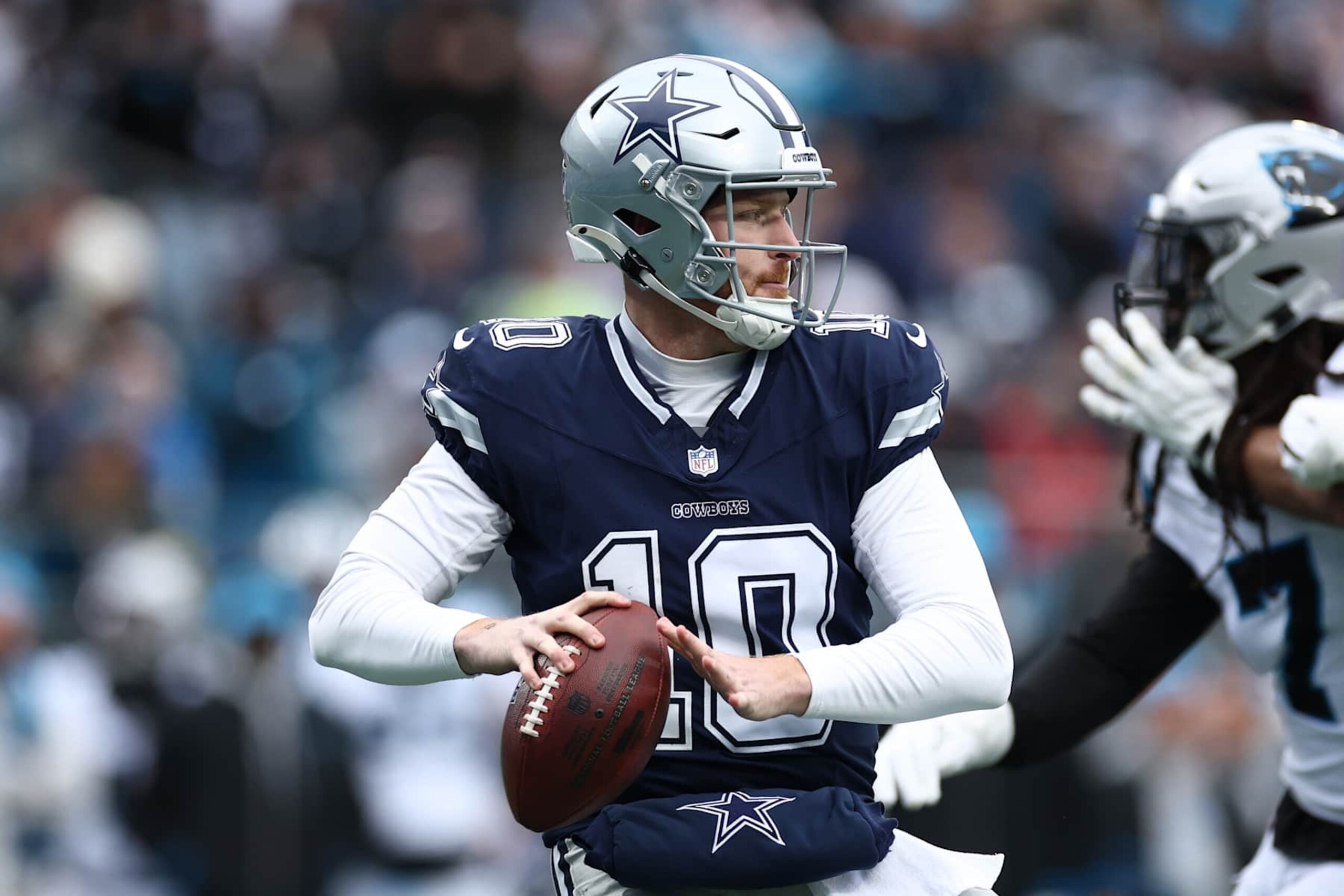 CHARLOTTE, NORTH CAROLINA - DECEMBER 15: Cooper Rush #10 of the Dallas Cowboys drops to pass against the Carolina Panthers during the second quarter at Bank of America Stadium on December 15, 2024 in Charlotte, North Carolina. (Photo by Jared C. Tilton/Getty Images)