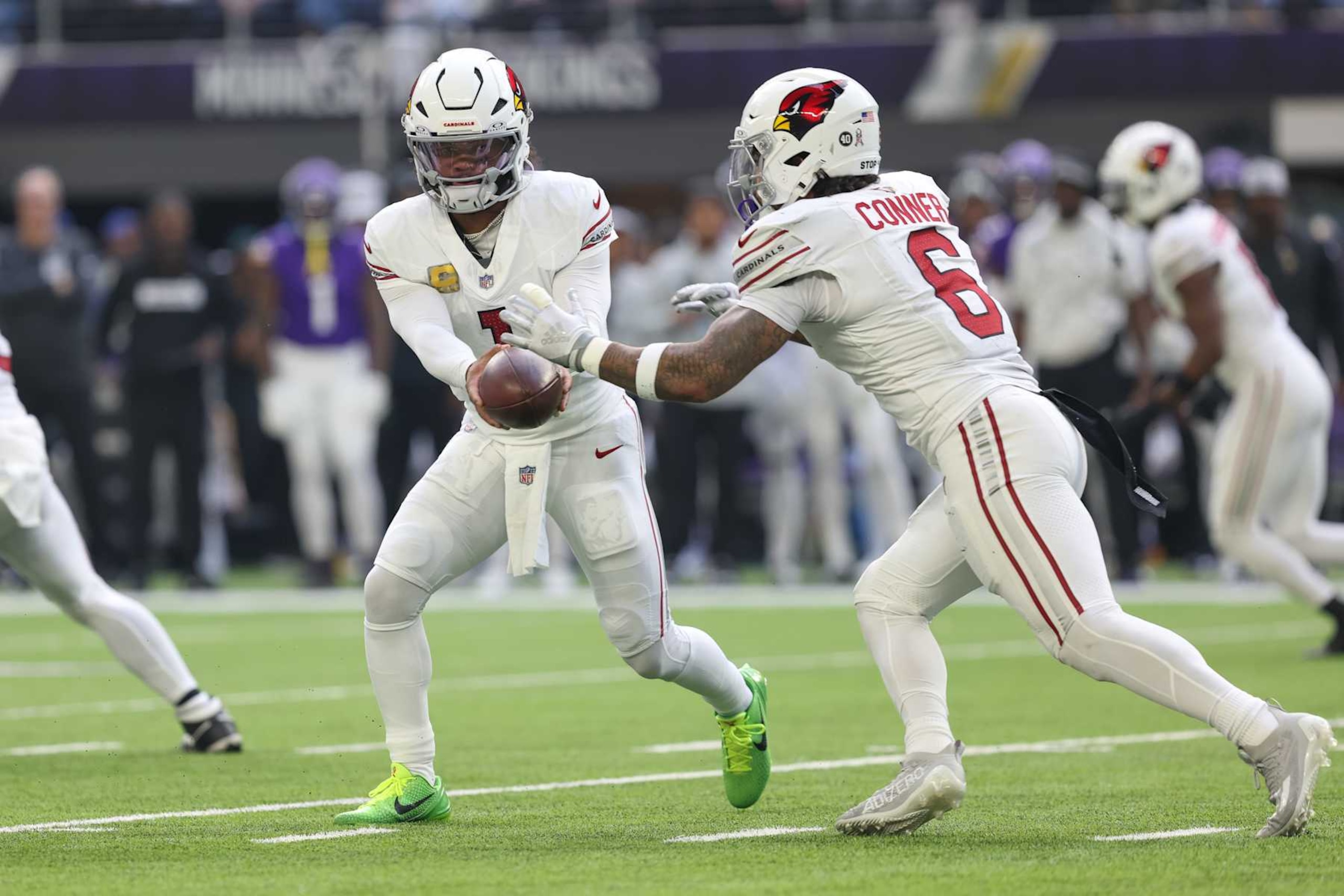 MINNEAPOLIS, MN - DECEMBER 01: Arizona Cardinals quarterback Kyler Murray (1) hands the ball to running back James Conner (6) during the NFL game between the Arizona Cardinals and the Minnesota Vikings on December 1st, 2024, at U.S. Bank Stadium in Minneapolis, MN. (Photo by Bailey Hillesheim/Icon Sportswire via Getty Images)
