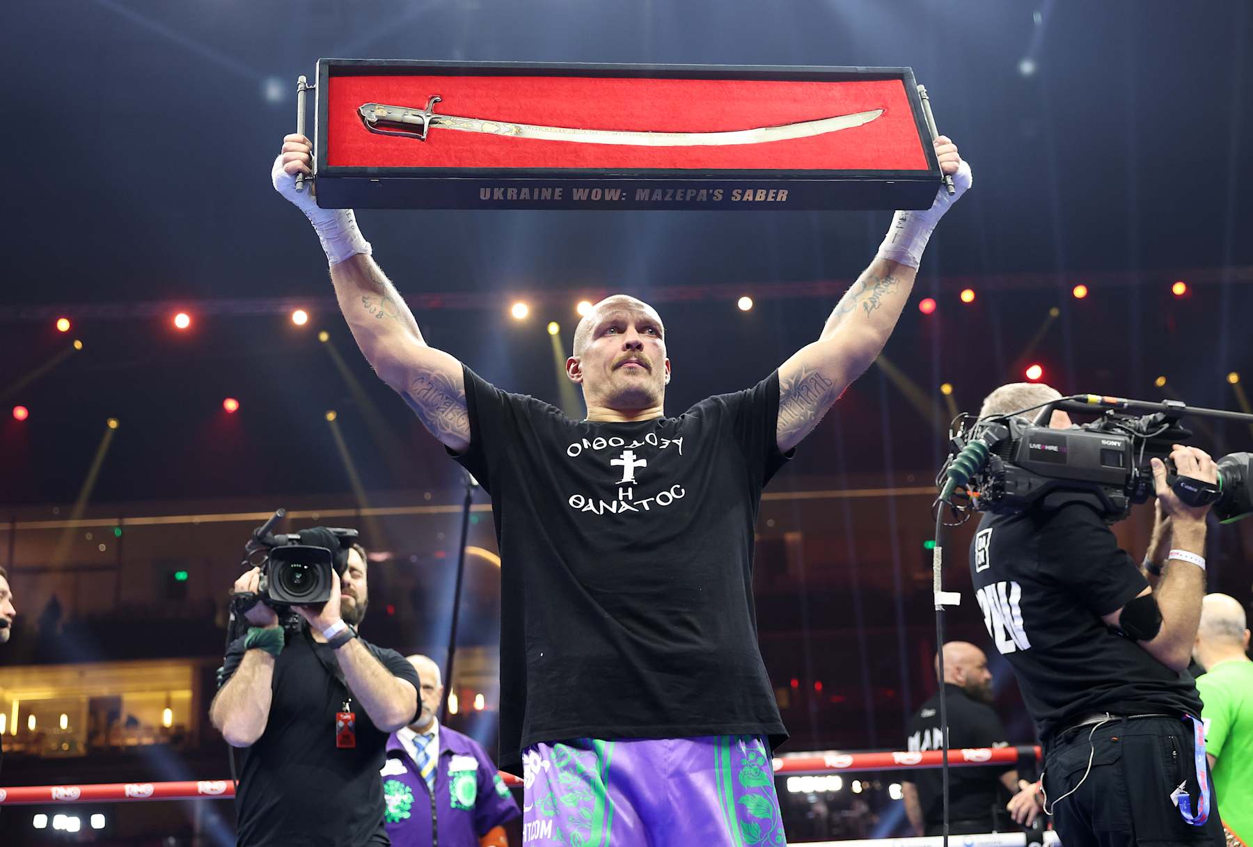 RIYADH, SAUDI ARABIA - DECEMBER 21: Oleksandr Usyk celebrates after beating Tyson Fury at Kingdom Arena on December 21, 2024 in Riyadh, Saudi Arabia. (Photo by Mark Robinson/Getty Images).