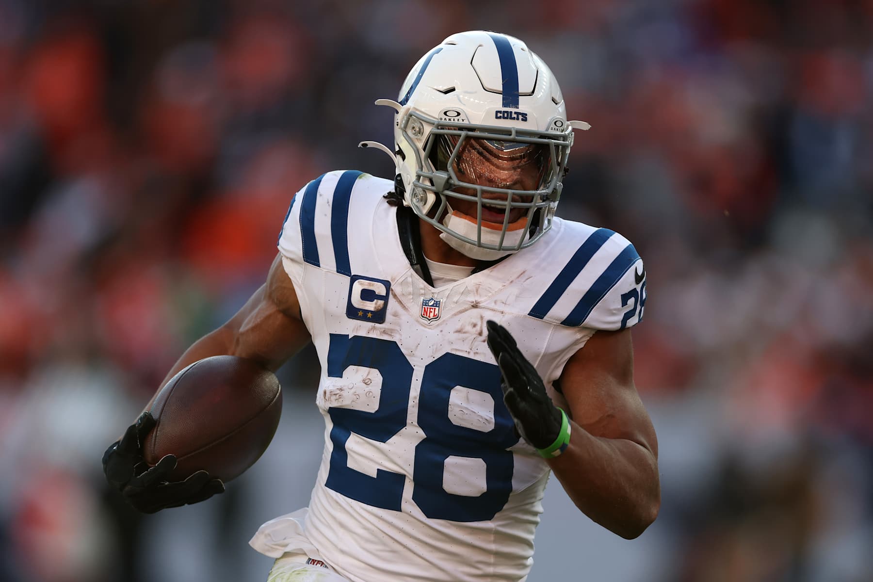 DENVER, COLORADO - DECEMBER 15: Jonathan Taylor #28 of the Indianapolis Colts carries the ball against the Denver Broncos during the first quarter at Empower Field At Mile High on December 15, 2024 in Denver, Colorado. (Photo by Matthew Stockman/Getty Images)