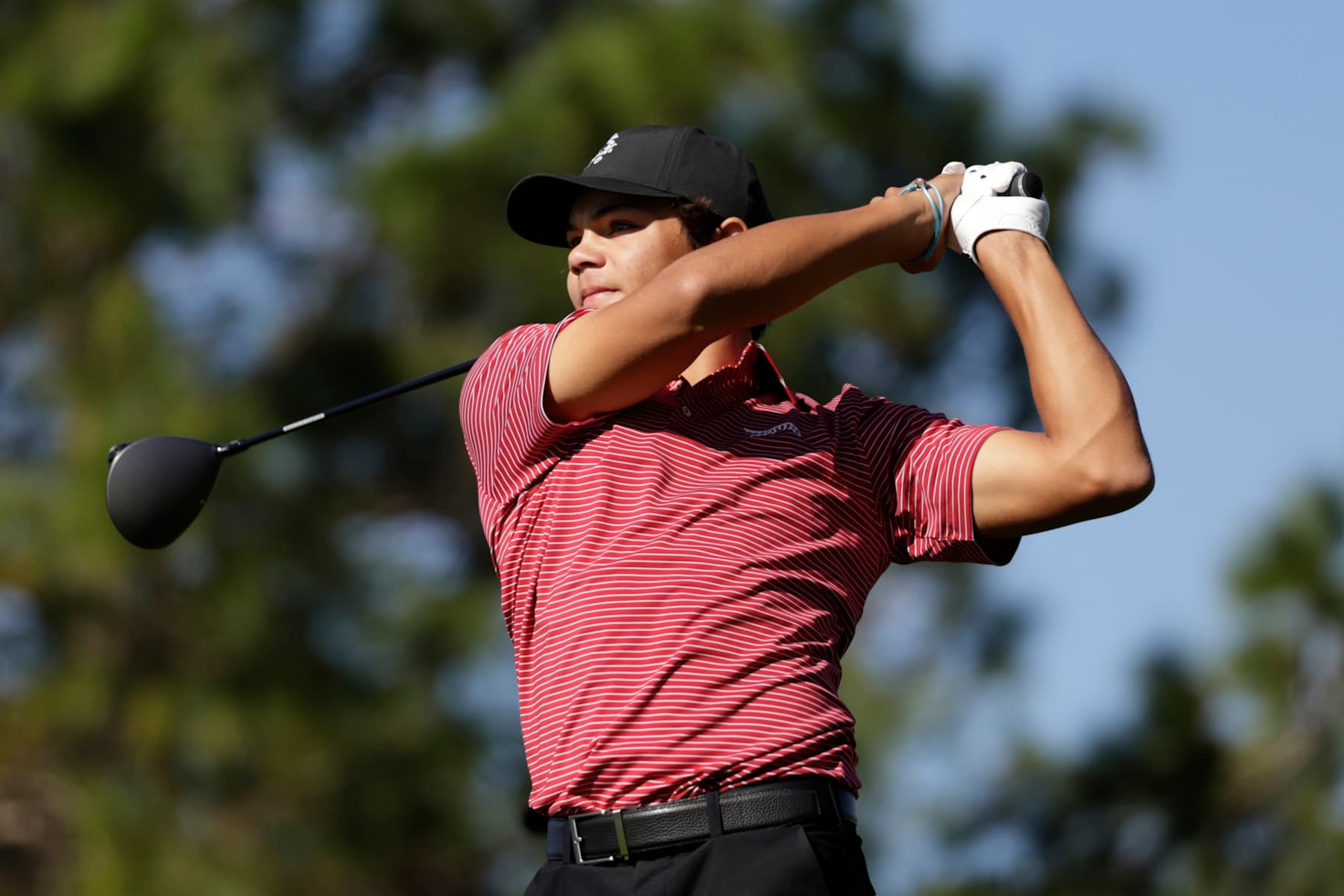 ORLANDO, FLORIDA - DECEMBER 22: Charlie Woods of the United States plays his shot from the second tee during the second round of the PNC Championship at Ritz-Carlton Golf Club on December 22, 2024 in Orlando, Florida. (Photo by Douglas P. DeFelice/Getty Images)