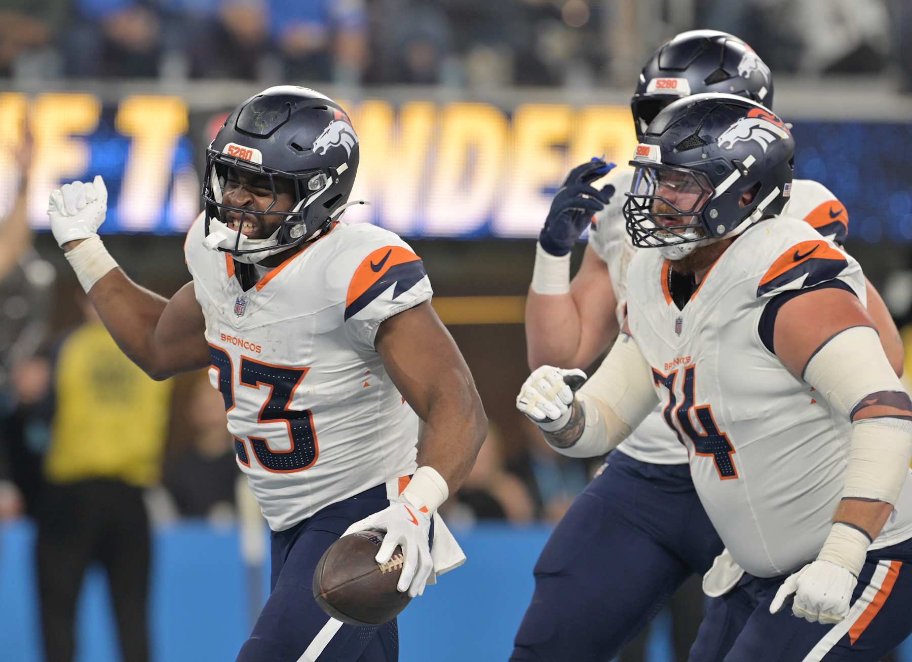INGLEWOOD, CALIFORNIA - DECEMBER 19: Denver Broncos running back Audric Estime (23), left, celebrates after rushing for a touchdown as they play the Los Angeles Chargers at SoFi Stadium in Inglewood, California on December 19, 2024. (Photo by RJ Sangosti/MediaNews Group/The Denver Post via Getty Images)