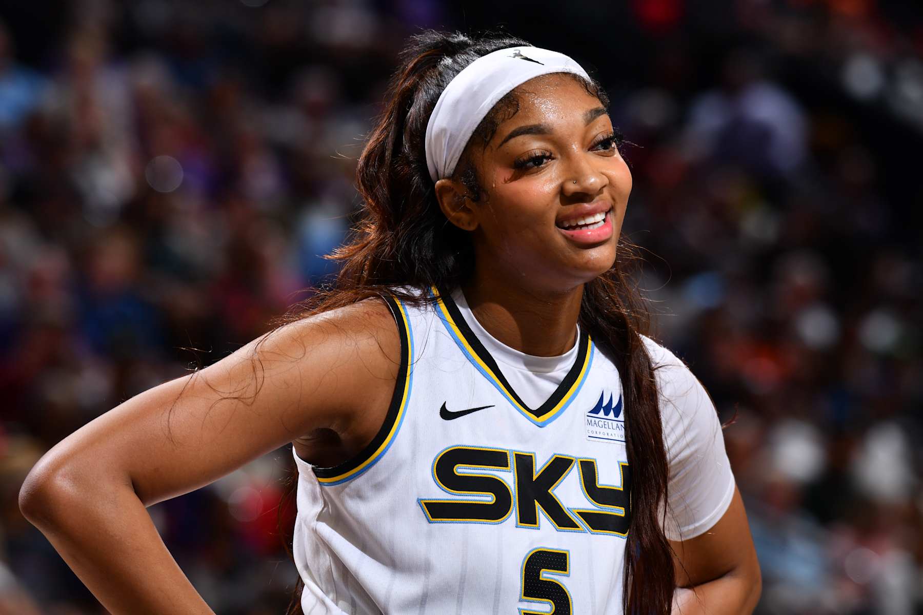PHOENIX, AZ - AUGUST 18: Angel Reese #5 of the Chicago Sky smiles during the game against the Phoenix Mercury on August 18, 2024 at Footprint Center in Phoenix, Arizona. NOTE TO USER: User expressly acknowledges and agrees that, by downloading and or using this photograph, user is consenting to the terms and conditions of the Getty Images License Agreement. Mandatory Copyright Notice: Copyright 2024 NBAE (Photo by Barry Gossage/NBAE via Getty Images)