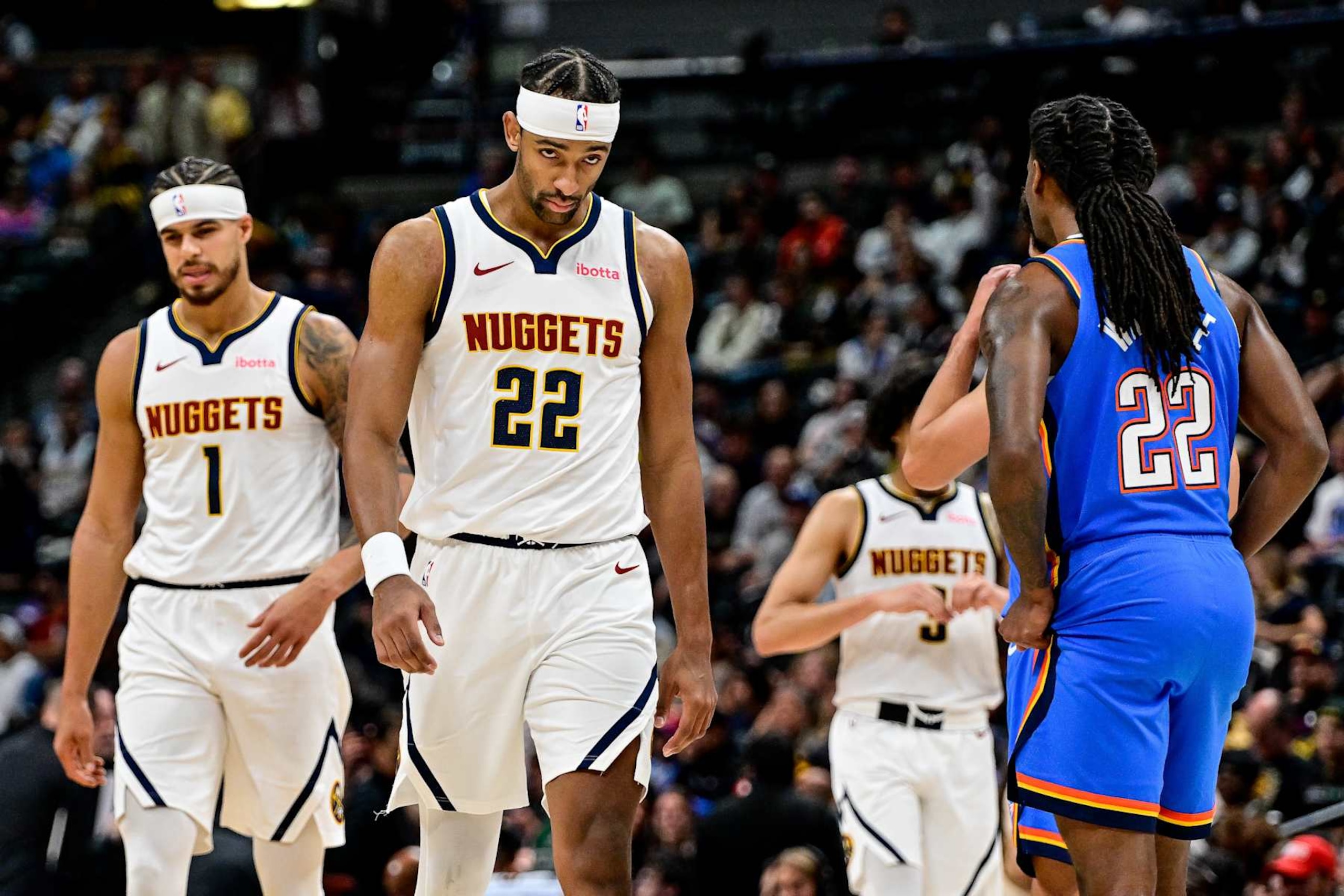 DENVER, COLORADO - OCTOBER 25: Zeke Nnaji #22 and Michael Porter Jr. #1 of the Denver Nuggets look on in the second half of a game against the Oklahoma City Thunder at Ball Arena on October 15, 2024 in Denver, Colorado. NOTE TO USER: User expressly acknowledges and agrees that, by downloading and or using this photograph, User is consenting to the terms and conditions of the Getty Images License Agreement. (Photo by Dustin Bradford/Getty Images)