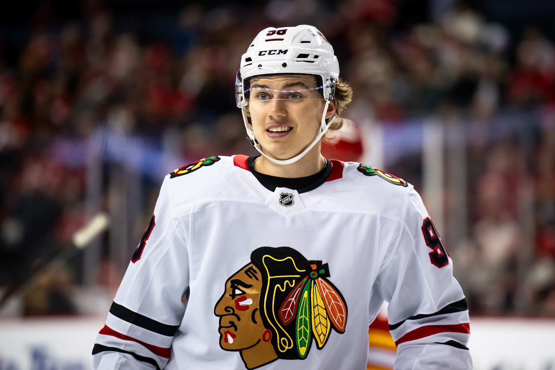 CALGARY, AB - OCTOBER 15: Chicago Blackhawks Center Connor Bedard (98) smiles after a whistle during the second period of an NHL game between the Calgary Flames and the Chicago Blackhawks on October 15, 2024, at the Scotiabank Saddledome in Calgary, AB. (Photo by Brett Holmes/Icon Sportswire via Getty Images)