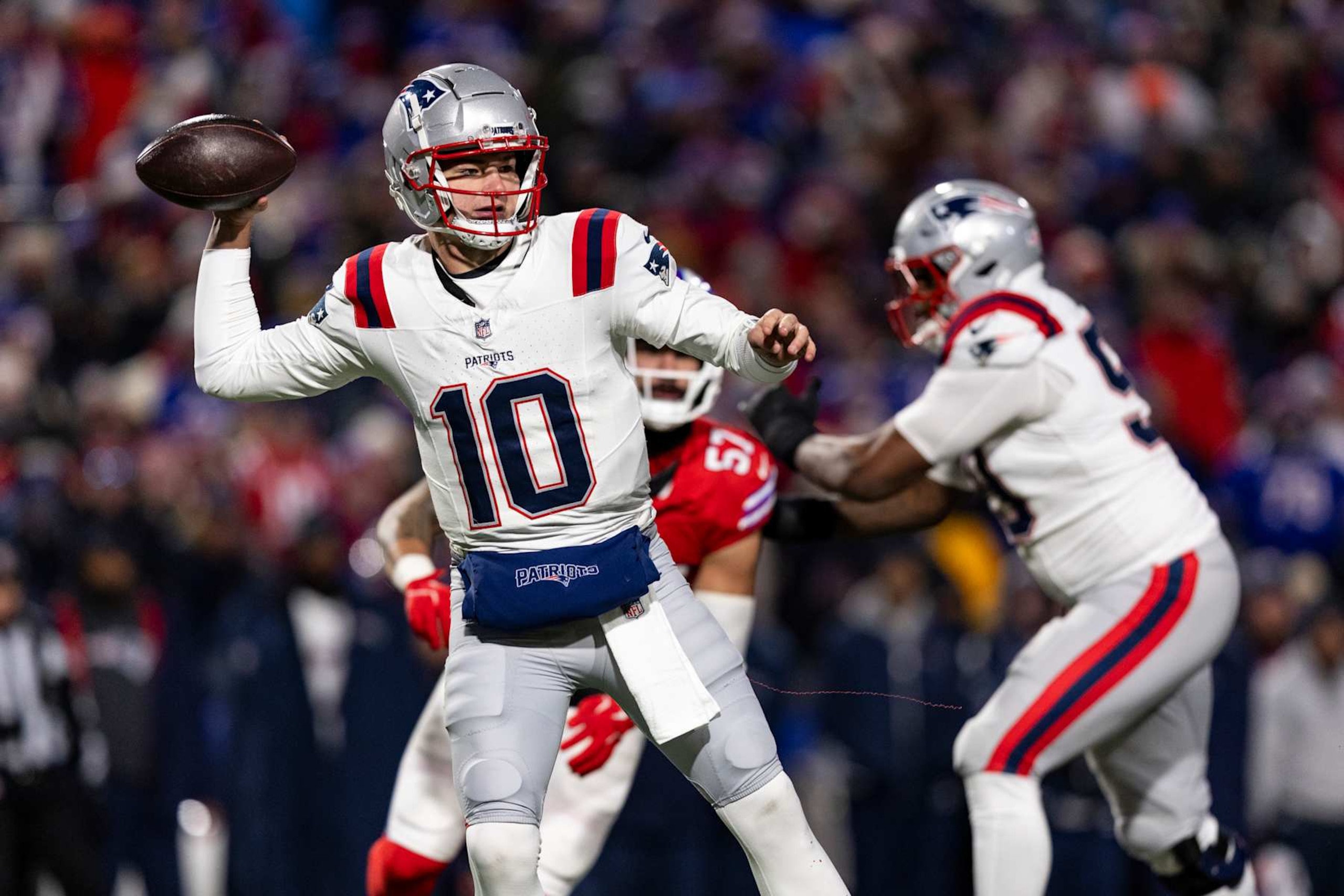 ORCHARD PARK, NEW YORK - DECEMBER 22: Drake Maye #10 of the New England Patriots throws a pass in the second quarter of the game against the Buffalo Bills at Highmark Stadium on December 22, 2024 in Orchard Park, New York. The Bills beat the Patriots 24-21. (Photo by Lauren Leigh Bacho/Getty Images)