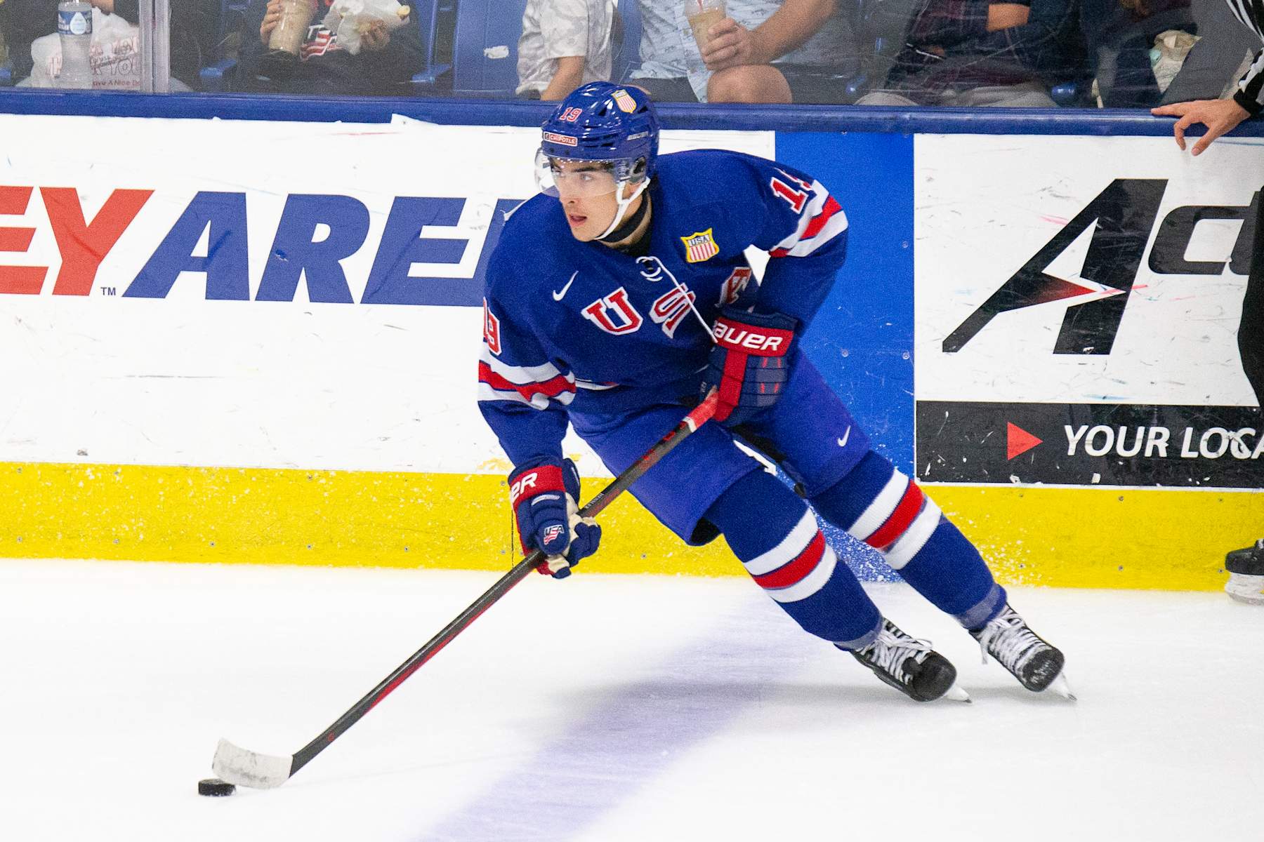 PLYMOUTH, MI - AUGUST 03: Logan Hensler #19 of Team USA skates with the puck during the 2024 World Junior Summer Showcase between Canada and USA at USA Hockey Arena on August 3, 2024 in Plymouth, Michigan. (Photo by Michael Miller/ISI Photos/Getty Images)