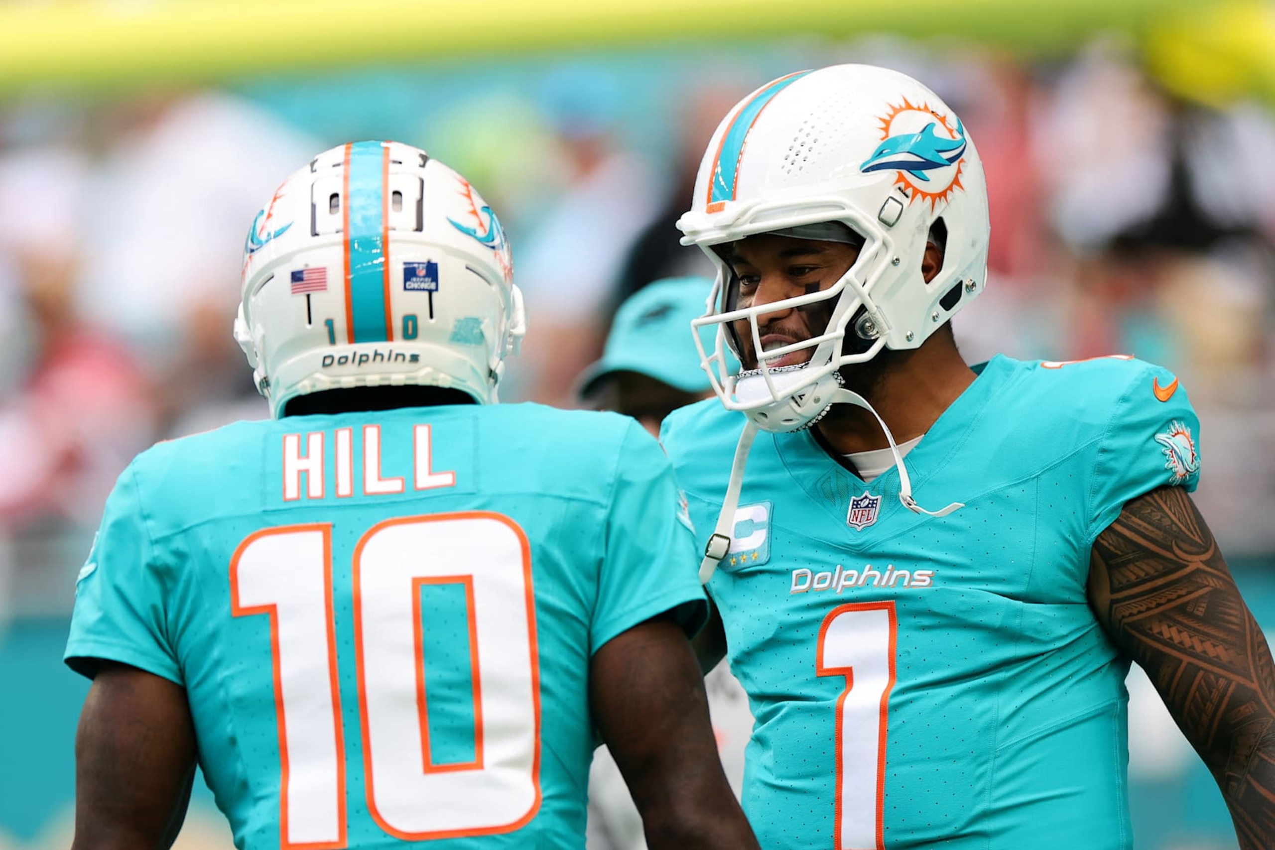 MIAMI GARDENS, FLORIDA - DECEMBER 22: Tyreek Hill #10 of the Miami Dolphins talks with teammate Tua Tagovailoa #1 before playing the San Francisco 49ers at Hard Rock Stadium on December 22, 2024 in Miami Gardens, Florida. (Photo by Carmen Mandato/Getty Images) MIAMI GARDENS, FLORIDA - DECEMBER 22: Tyreek Hill #10 of the Miami Dolphins talks with teammate Tua Tagovailoa #1 before playing the San Francisco 49ers at Hard Rock Stadium on December 22, 2024 in Miami Gardens, Florida. (Photo by Carmen Mandato/Getty Images)