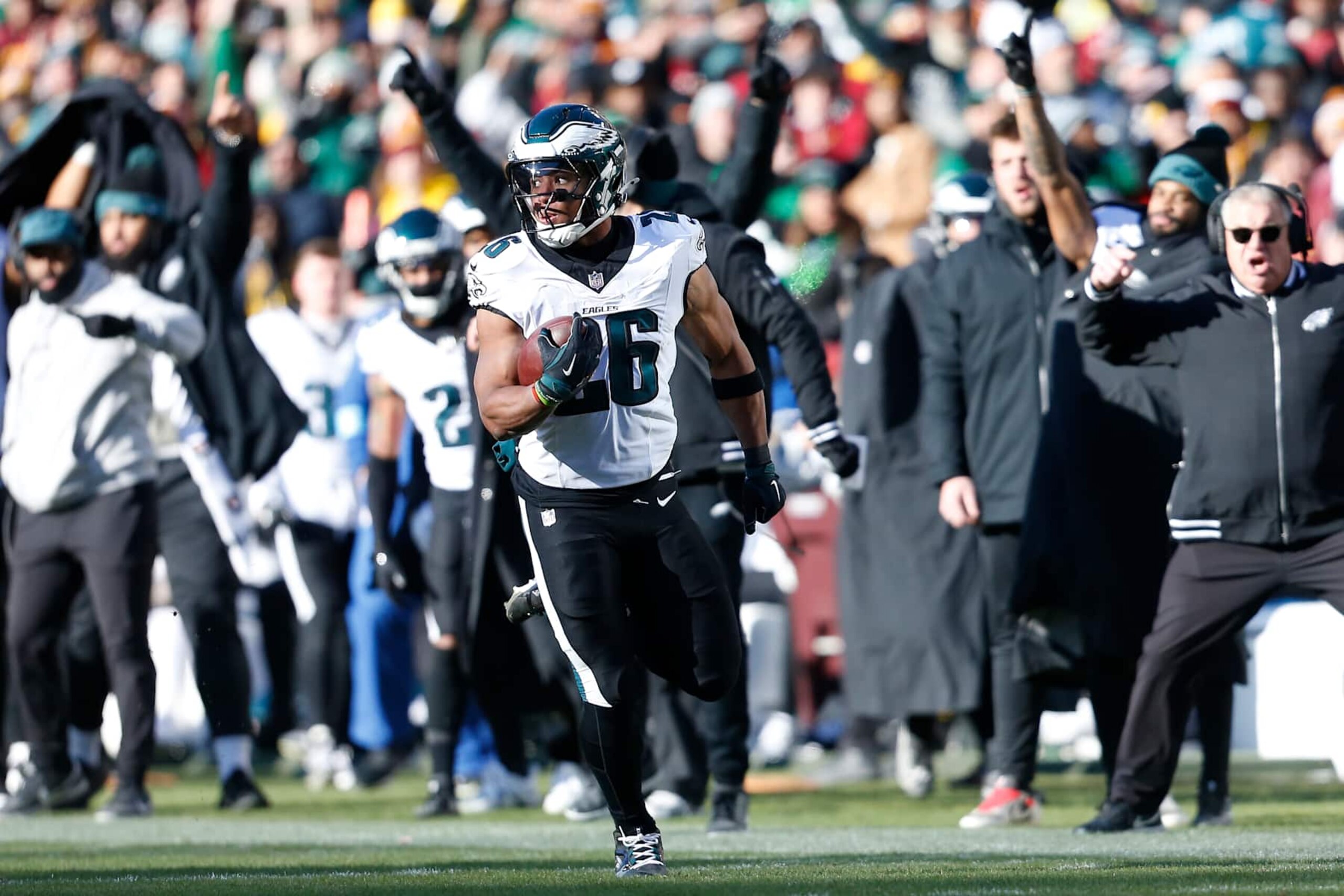 LANDOVER, MD - DECEMBER 22: Philadelphia Eagles running back Saquon Barkley (26) rushes upfield en route to scoring a touchdown during the Philadelphia Eagles game versus the Washington Commanders at Northwest Stadium on December 22, 2024, in Landover, MD. (Photo by Lee Coleman/Icon Sportswire via Getty Images)
