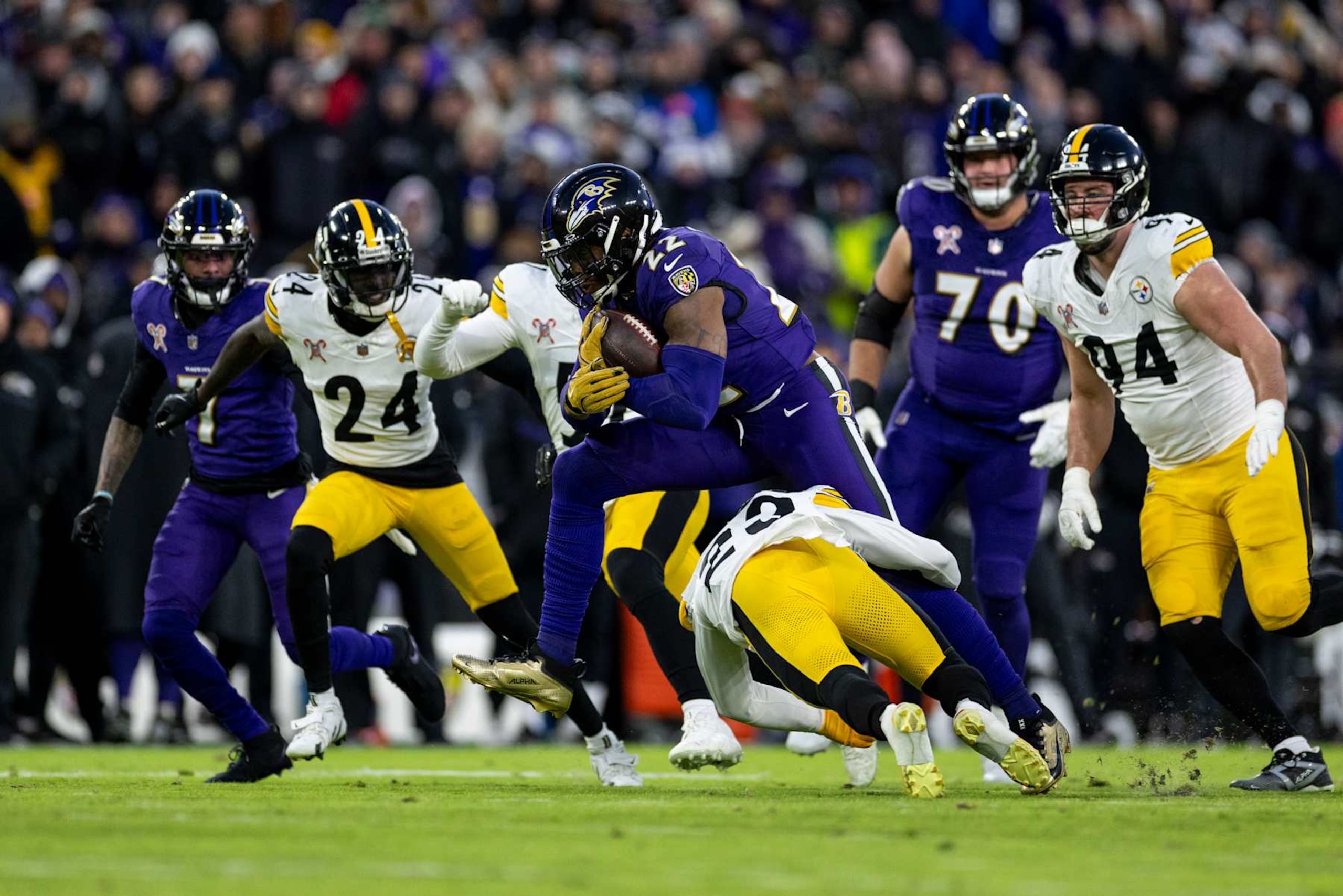 BALTIMORE, MARYLAND - DECEMBER 21: Derrick Henry #22 of the Baltimore Ravens hurdles against Damontae Kazee #23 of the Pittsburgh Steelers during an NFL Football game at M&T Bank Stadium on December 21, 2024 in Baltimore, Maryland. (Photo by Michael Owens/Getty Images)