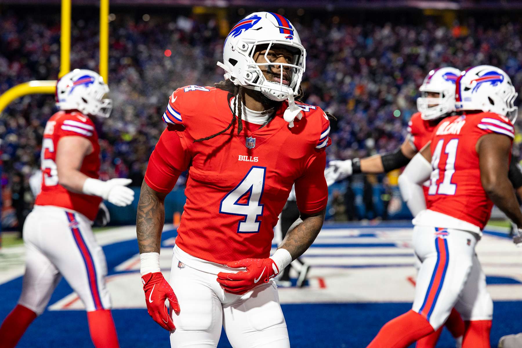 ORCHARD PARK, NEW YORK - DECEMBER 22: James Cook #4 of the Buffalo Bills celebrates after scoring a touchdown in the second quarter of the game against the New England Patriots at Highmark Stadium on December 22, 2024 in Orchard Park, New York. The Bills beat the Patriots 24-21. (Photo by Lauren Leigh Bacho/Getty Images)