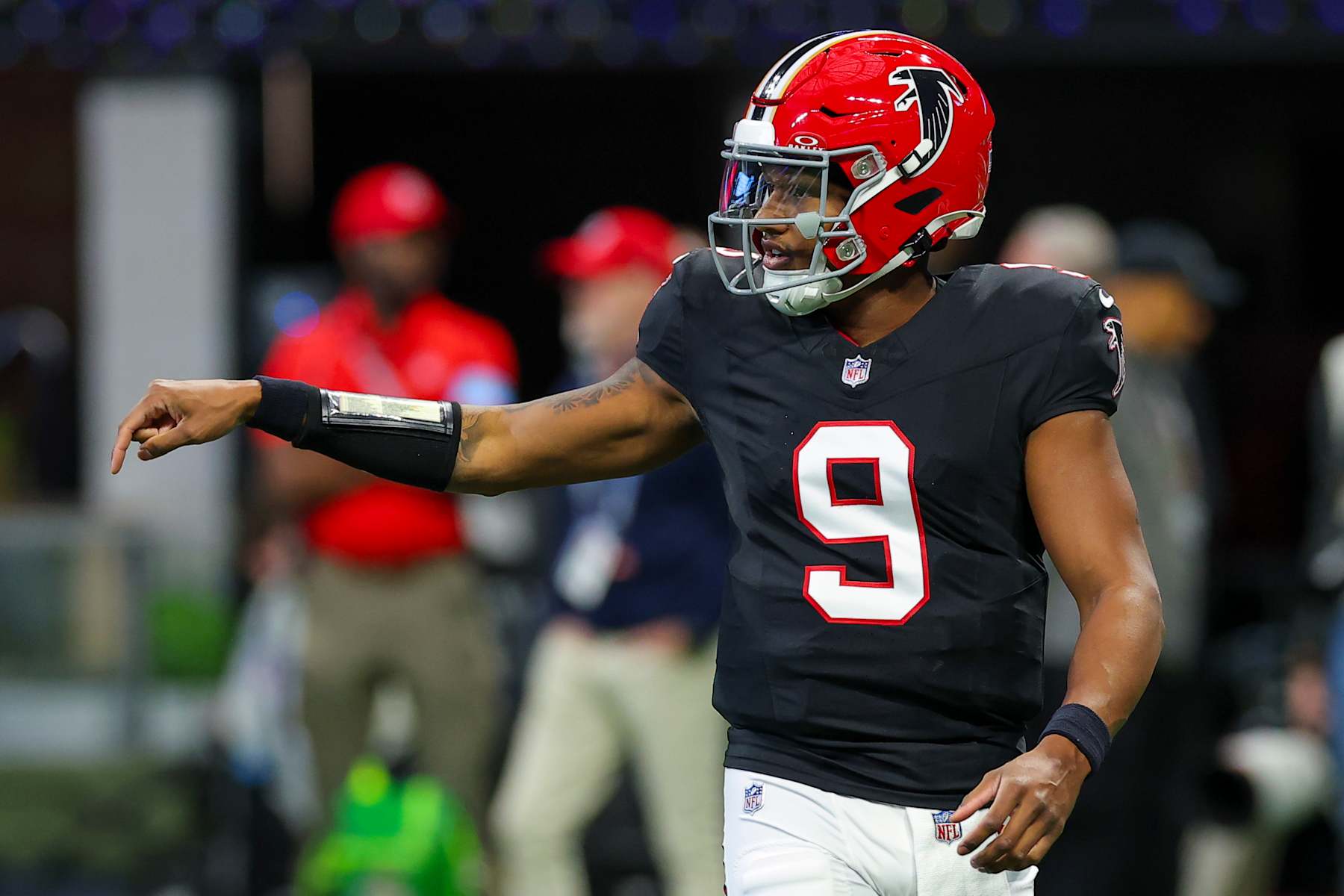 ATLANTA, GEORGIA - DECEMBER 22: Michael Penix Jr. #9 of the Atlanta Falcons runs onto the field during the first quarter against the New York Giants at Mercedes-Benz Stadium on December 22, 2024 in Atlanta, Georgia. (Photo by Kevin C. Cox/Getty Images)
