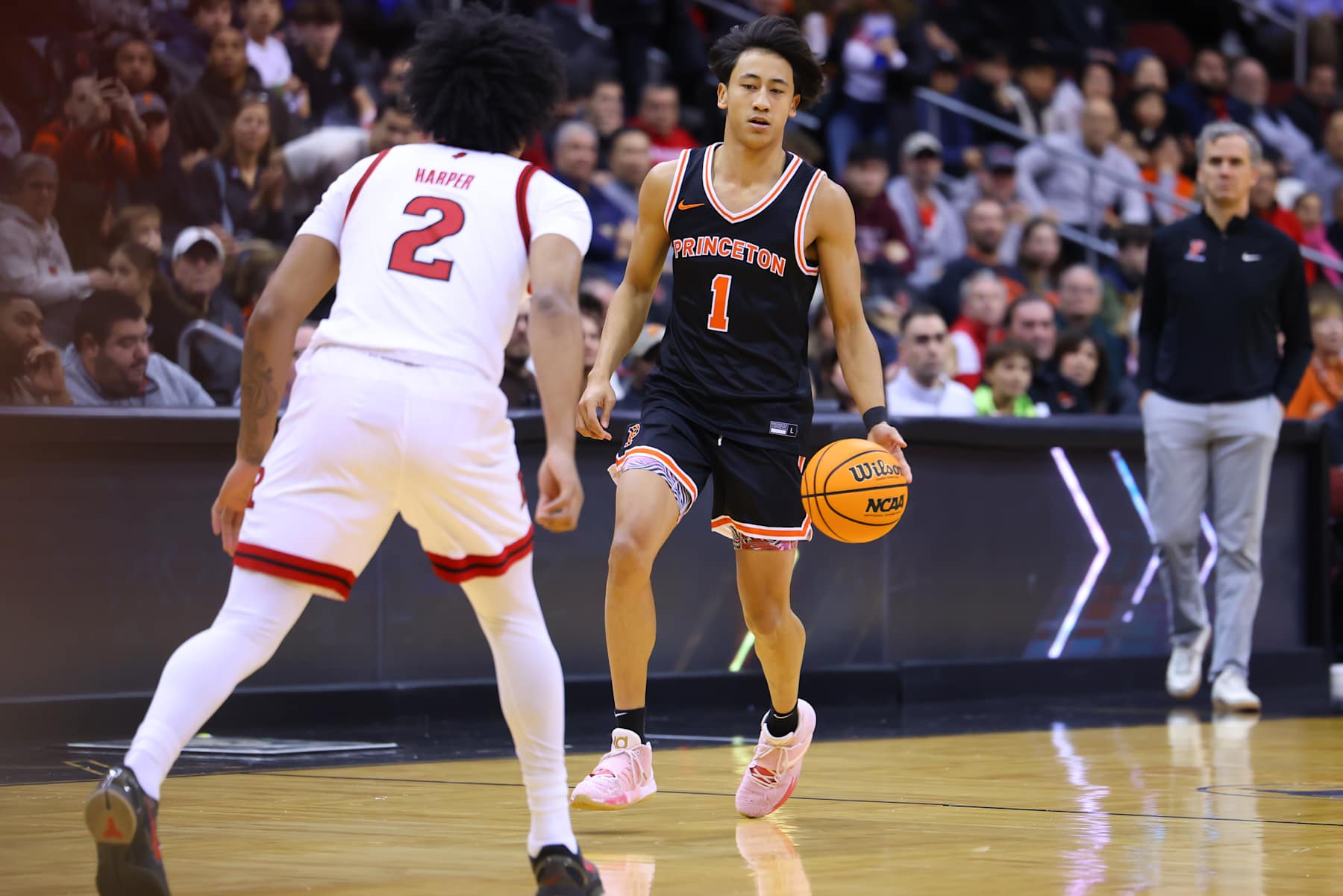 NEWARK, NJ - DECEMBER 21:  Xaivian Lee #1 of the Princeton Tigers controls the ball during the Never Forget Tribute Classic game against the Rutgers Scarlet Knights on December 21, 2024 at the Prudential Center in Newark, New Jersey.  (Photo by Rich Graessle/Icon Sportswire via Getty Images)