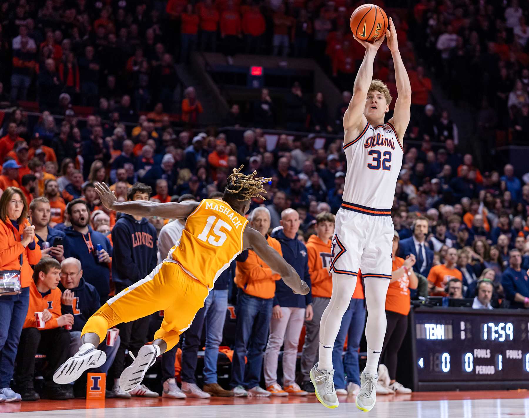 CHAMPAIGN, ILLINOIS - DECEMBER 14: Kasparas Jakucionis #32 of the Illinois Fighting Illini shoots the ball against Jahmai Mashack #15 of the Tennessee Volunteers at State Farm Center on December 14, 2024 in Champaign, Illinois. (Photo by Michael Hickey/Getty Images)