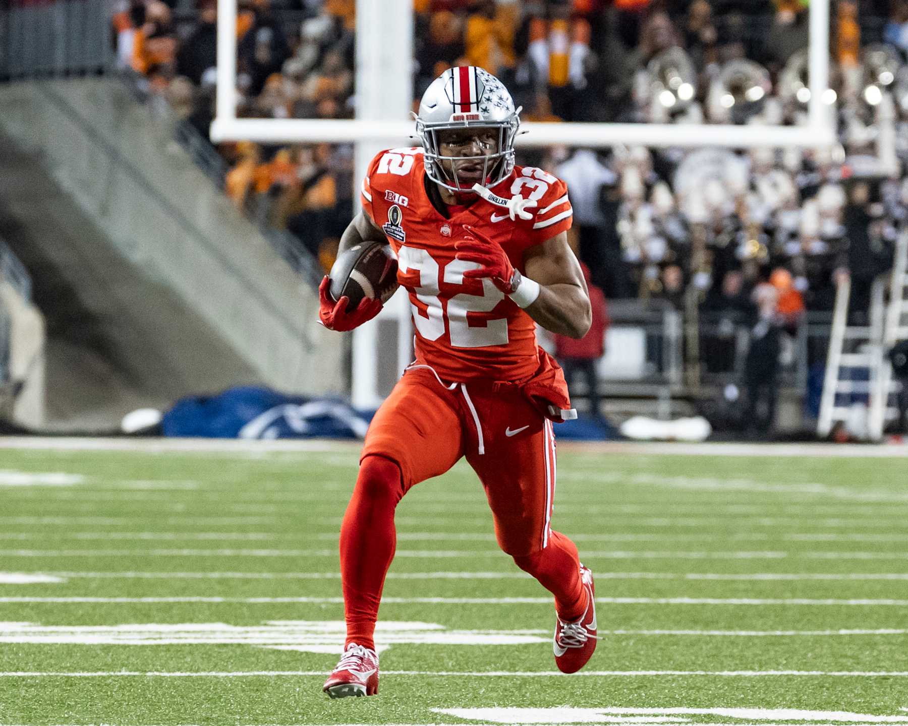 COLUMBUS, OHIO - DECEMBER 21: TreVeyon Henderson #32 of the Ohio State Buckeyes makes a run for a touchdown during a game between the Tennessee Volunteers and the Ohio State Buckeyes at Ohio Stadium on December 21, 2024 in Columbus, Ohio. (Photo by Steve Limentani/ISI Photos/Getty Images)