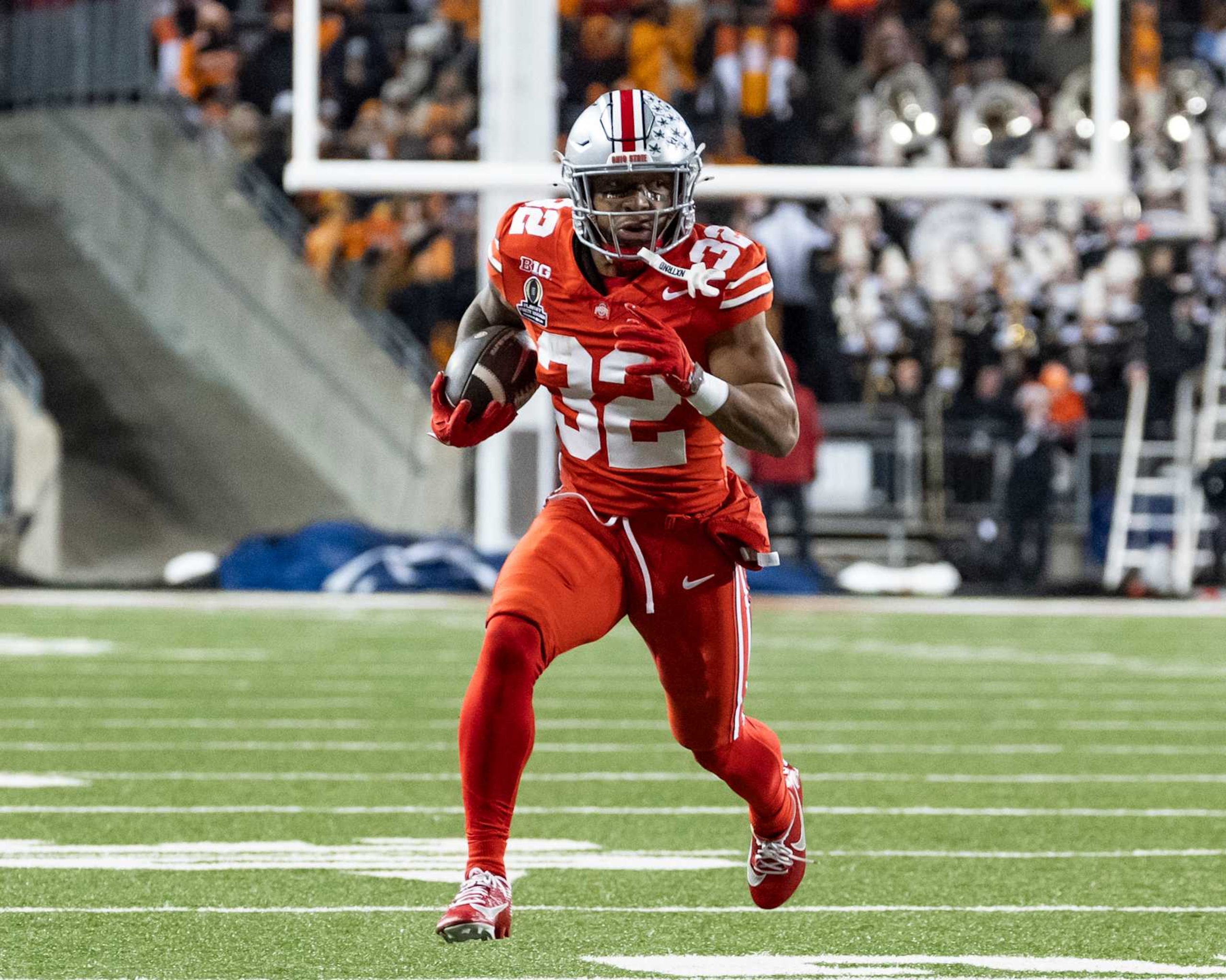 COLUMBUS, OHIO - DECEMBER 21: TreVeyon Henderson #32 of the Ohio State Buckeyes makes a run for a touchdown during a game between the Tennessee Volunteers and the Ohio State Buckeyes at Ohio Stadium on December 21, 2024 in Columbus, Ohio. (Photo by Steve Limentani/ISI Photos/Getty Images) COLUMBUS, OHIO - DECEMBER 21: TreVeyon Henderson #32 of the Ohio State Buckeyes makes a run for a touchdown during a game between the Tennessee Volunteers and the Ohio State Buckeyes at Ohio Stadium on December 21, 2024 in Columbus, Ohio. (Photo by Steve Limentani/ISI Photos/Getty Images)