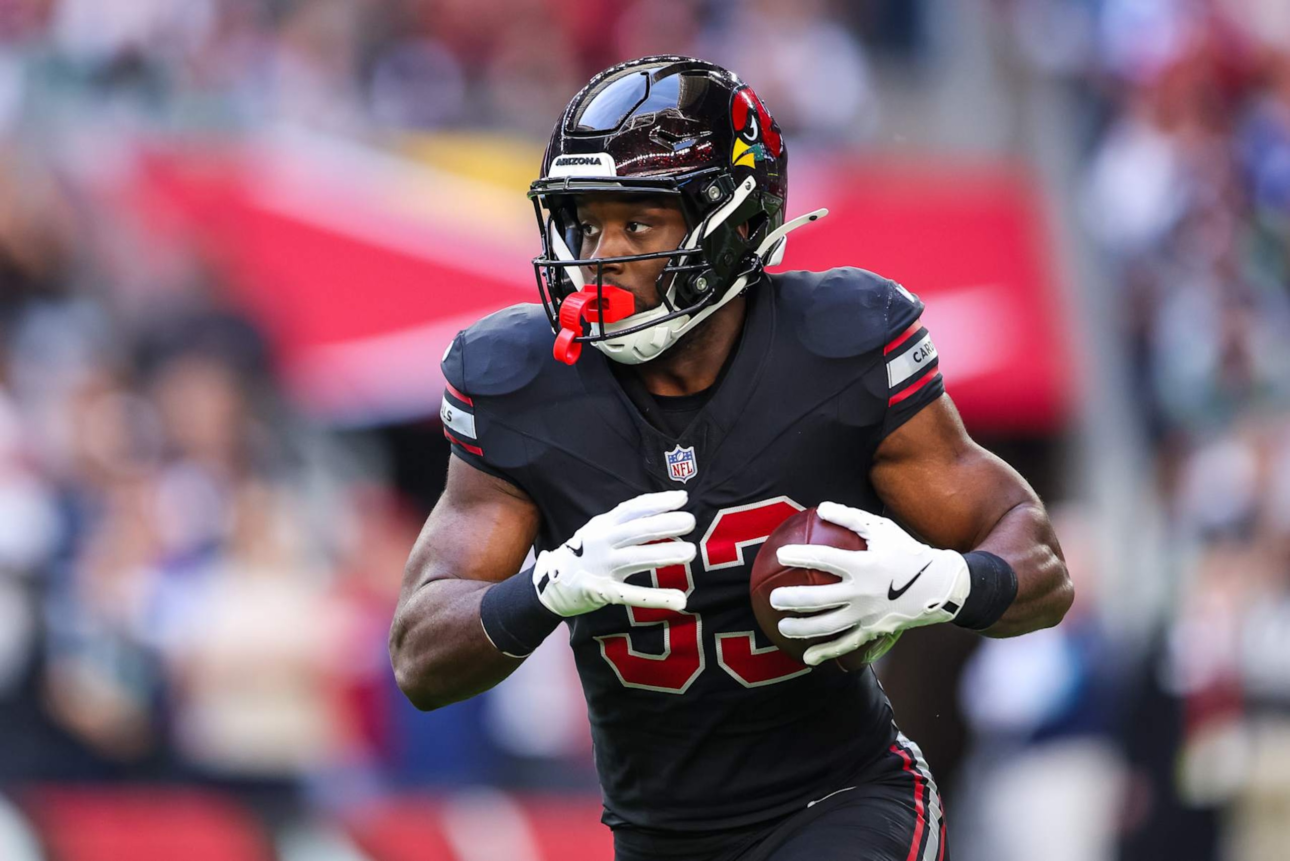 GLENDALE, ARIZONA - DECEMBER 8: Trey Benson #33 of the Arizona Cardinals runs the ball during the second quarter of a game against the Seattle Seahawks at State Farm Stadium on December 8, 2024 in Glendale, Arizona. (Photo by Mike Christy/Getty Images) GLENDALE, ARIZONA - DECEMBER 8: Trey Benson #33 of the Arizona Cardinals runs the ball during the second quarter of a game against the Seattle Seahawks at State Farm Stadium on December 8, 2024 in Glendale, Arizona. (Photo by Mike Christy/Getty Images)