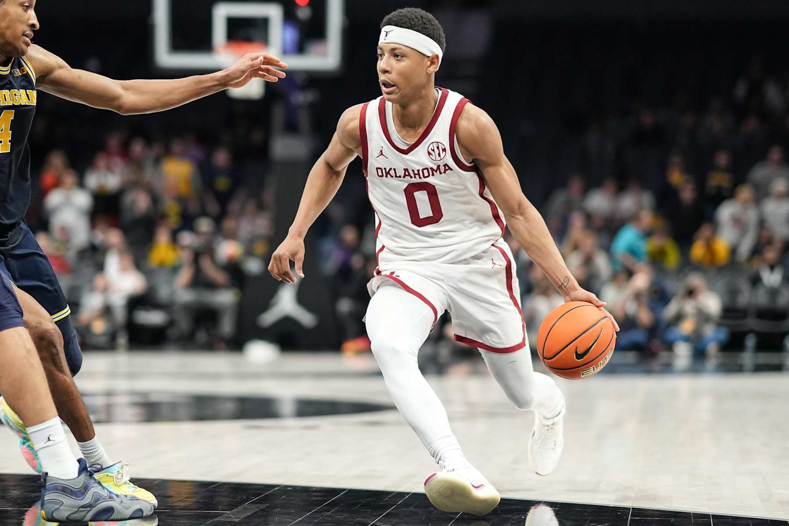 CHARLOTTE, NORTH CAROLINA - DECEMBER 18: Jeremiah Fears #0 of the Oklahoma Sooners drives to the basket in the second half of his game against the Michigan Wolverines during the Jumpman Invitational at Spectrum Center on December 18, 2024 in Charlotte, North Carolina. (Photo by Matt Kelley/Getty Images)