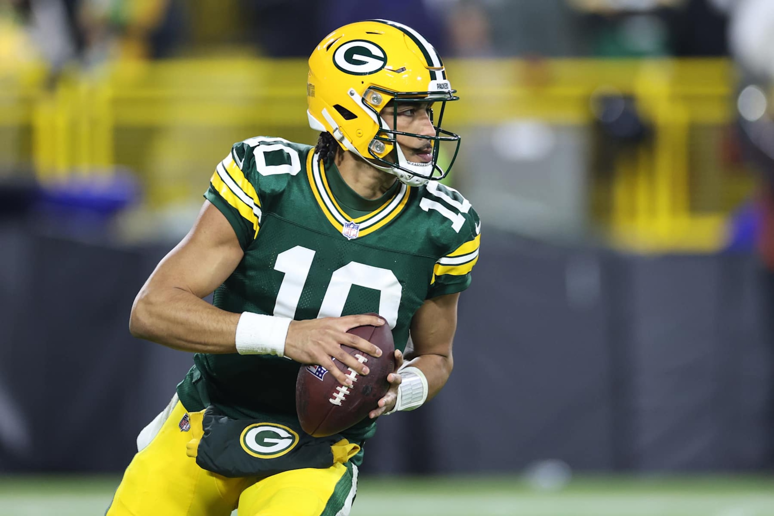 GREEN BAY, WISCONSIN - DECEMBER 23: Jordan Love #10 of the Green Bay Packers looks to pass the ball against the New Orleans Saints during the third quarter at Lambeau Field on December 23, 2024 in Green Bay, Wisconsin. (Photo by Stacy Revere/Getty Images)