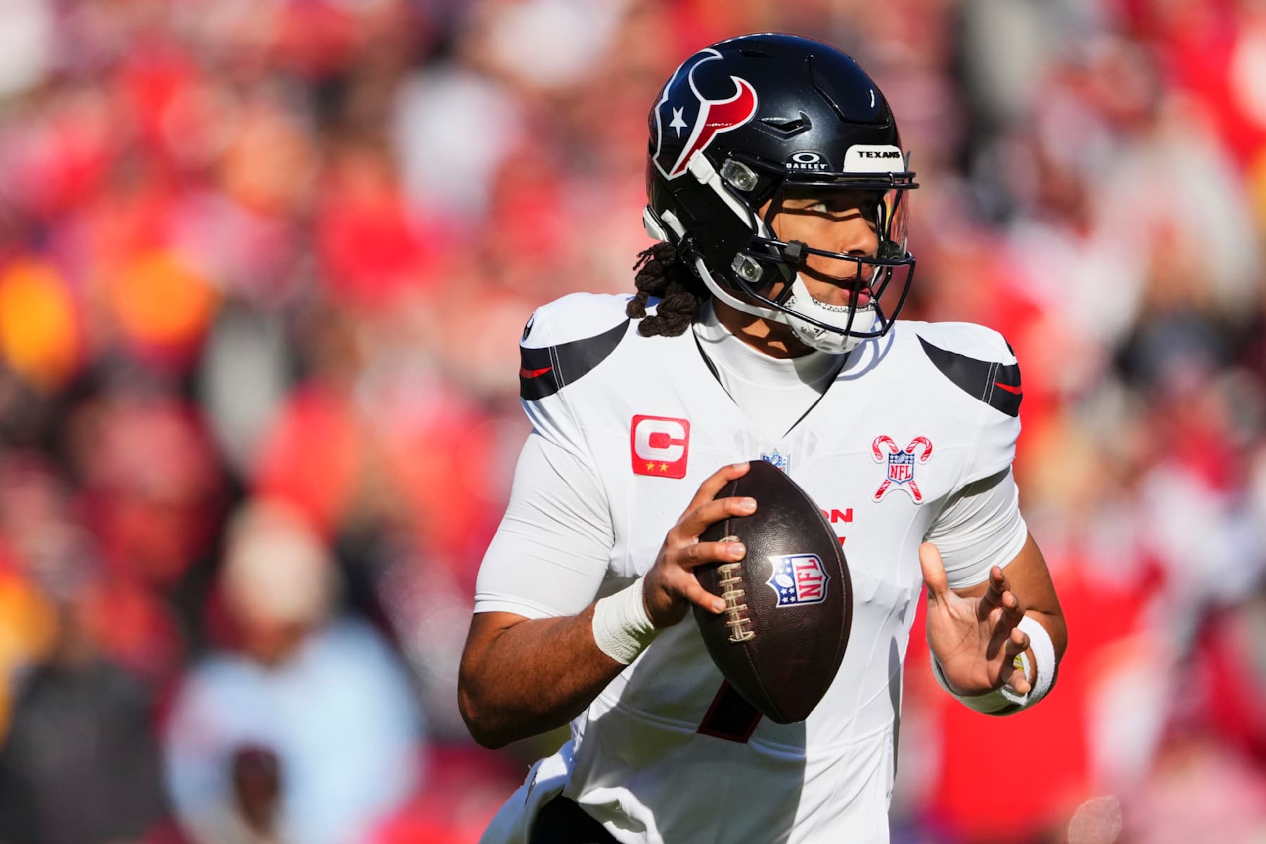 KANSAS CITY, MO - DECEMBER 21: C.J. Stroud #7 of the Houston Texans drops back to pass against the Kansas City Chiefs during an NFL football game at GEHA Field at Arrowhead Stadium on December 21, 2024 in Kansas City, Missouri. (Photo by Cooper Neill/Getty Images)