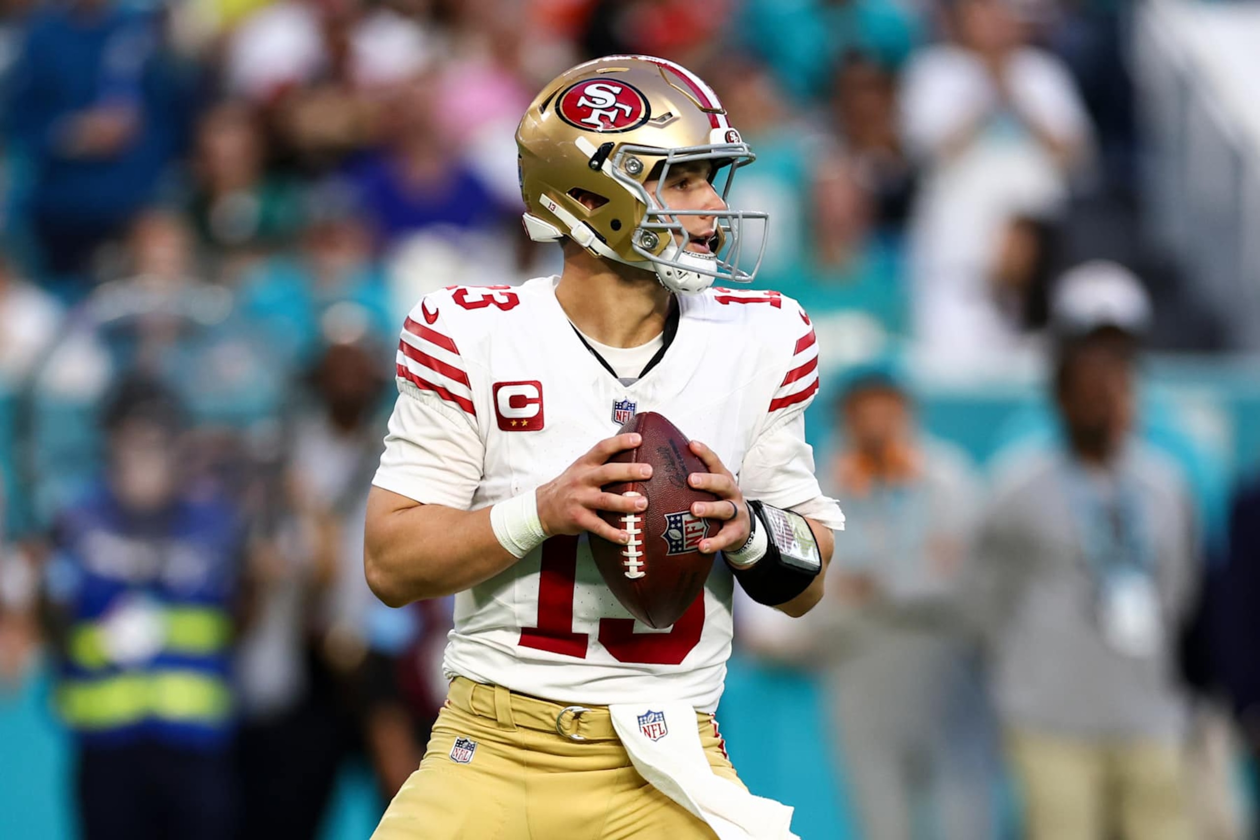 MIAMI GARDENS, FLORIDA - DECEMBER 22: Brock Purdy #13 of the San Francisco 49ers looks to throw a pass during the first half of an NFL football game against the Miami Dolphins at Hard Rock Stadium on December 22, 2024 in Miami Gardens, Florida. (Photo by Kevin Sabitus/Getty Images)