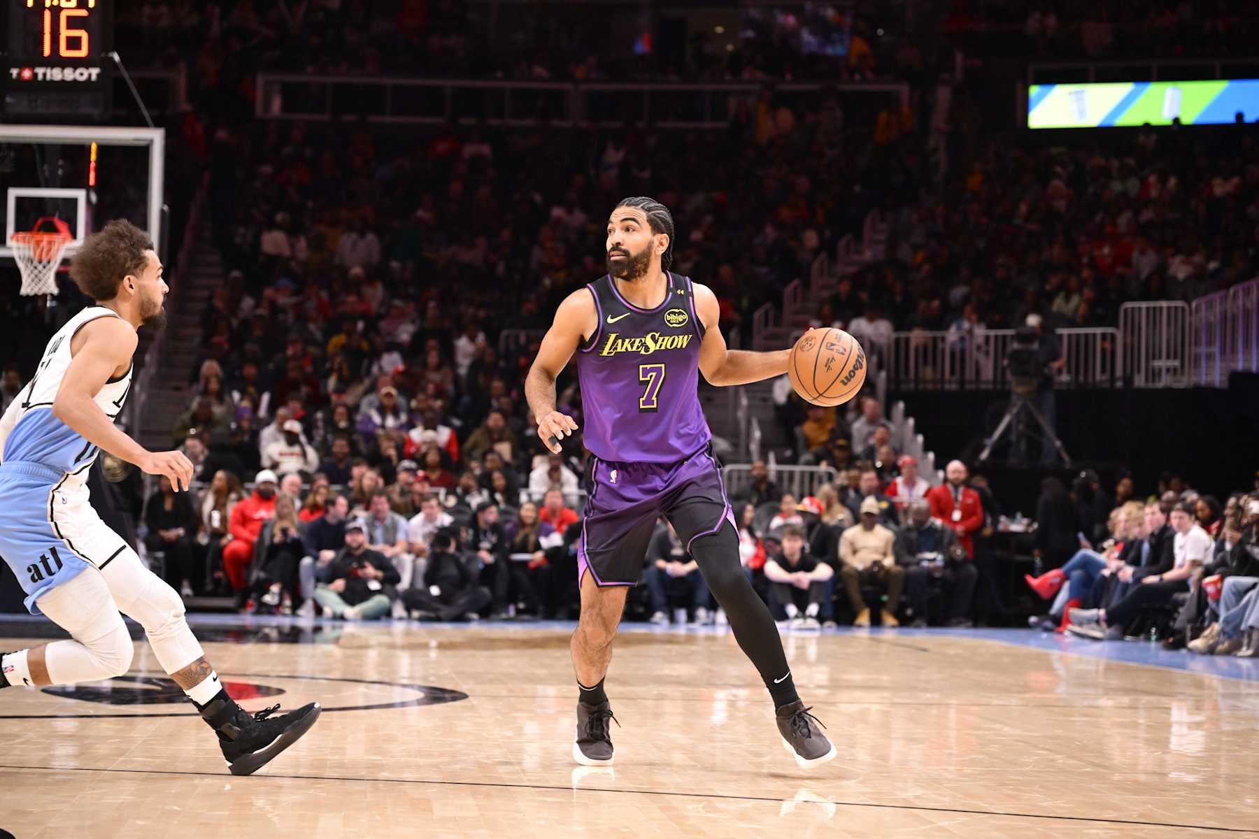 ATLANTA, GA - DECEMBER 6: Gabe Vincent #7 of the Los Angeles Lakers handles the ball during the game against the Atlanta Hawks on December 6, 2024 at State Farm Arena in Atlanta, Georgia.  NOTE TO USER: User expressly acknowledges and agrees that, by downloading and/or using this Photograph, user is consenting to the terms and conditions of the Getty Images License Agreement. Mandatory Copyright Notice: Copyright 2024 NBAE (Photo by Adam Hagy/NBAE via Getty Images)