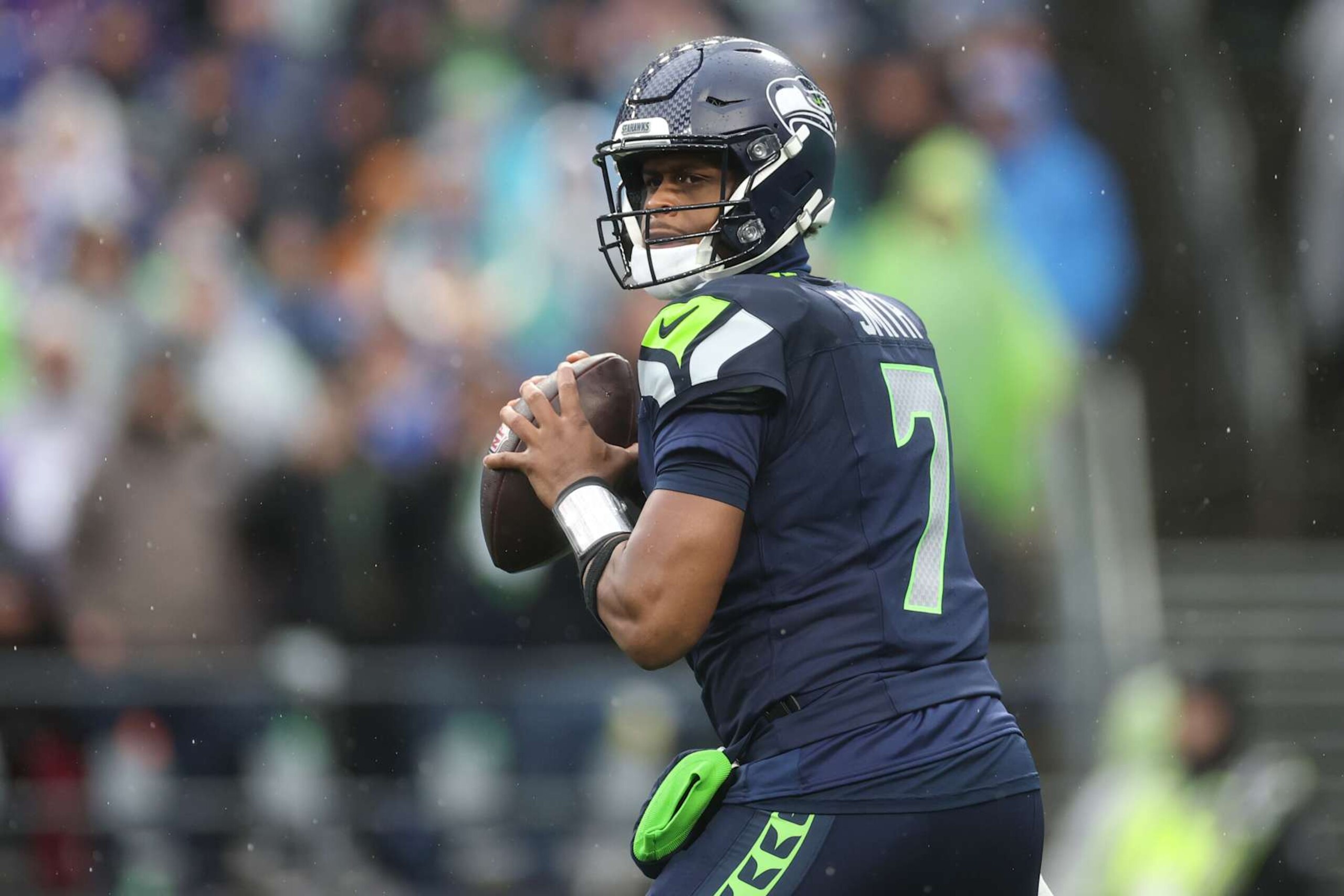 SEATTLE, WASHINGTON - DECEMBER 22: Geno Smith #7 of the Seattle Seahawks looks to pass the ball against the Minnesota Vikings during the second quarter at Lumen Field on December 22, 2024 in Seattle, Washington. (Photo by Steph Chambers/Getty Images)