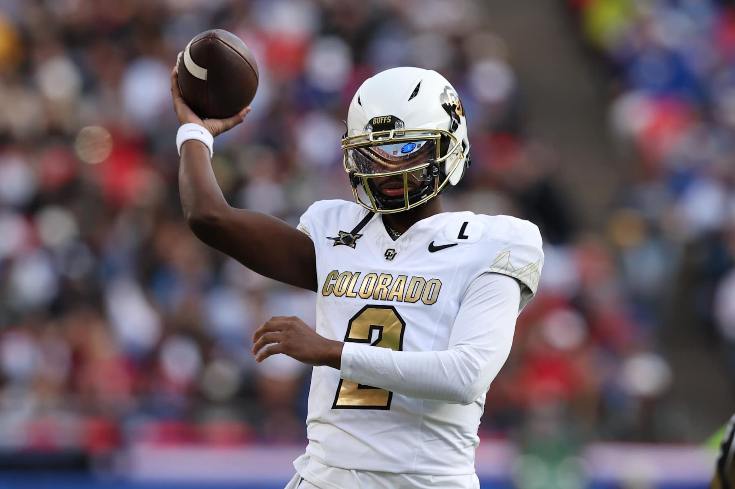 KANSAS CITY, MO - NOVEMBER 23: Colorado Buffaloes quarterback Shedeur Sanders (2) throws a warm up pass between drives in the second quarter of a Big 12 game between the Colorado Buffaloes and Kansas Jayhawks on November 23, 2024 at GEHA Field at Arrowhead Stadium in Kansas City, MO. (Photo by Scott Winters/Icon Sportswire via Getty Images)