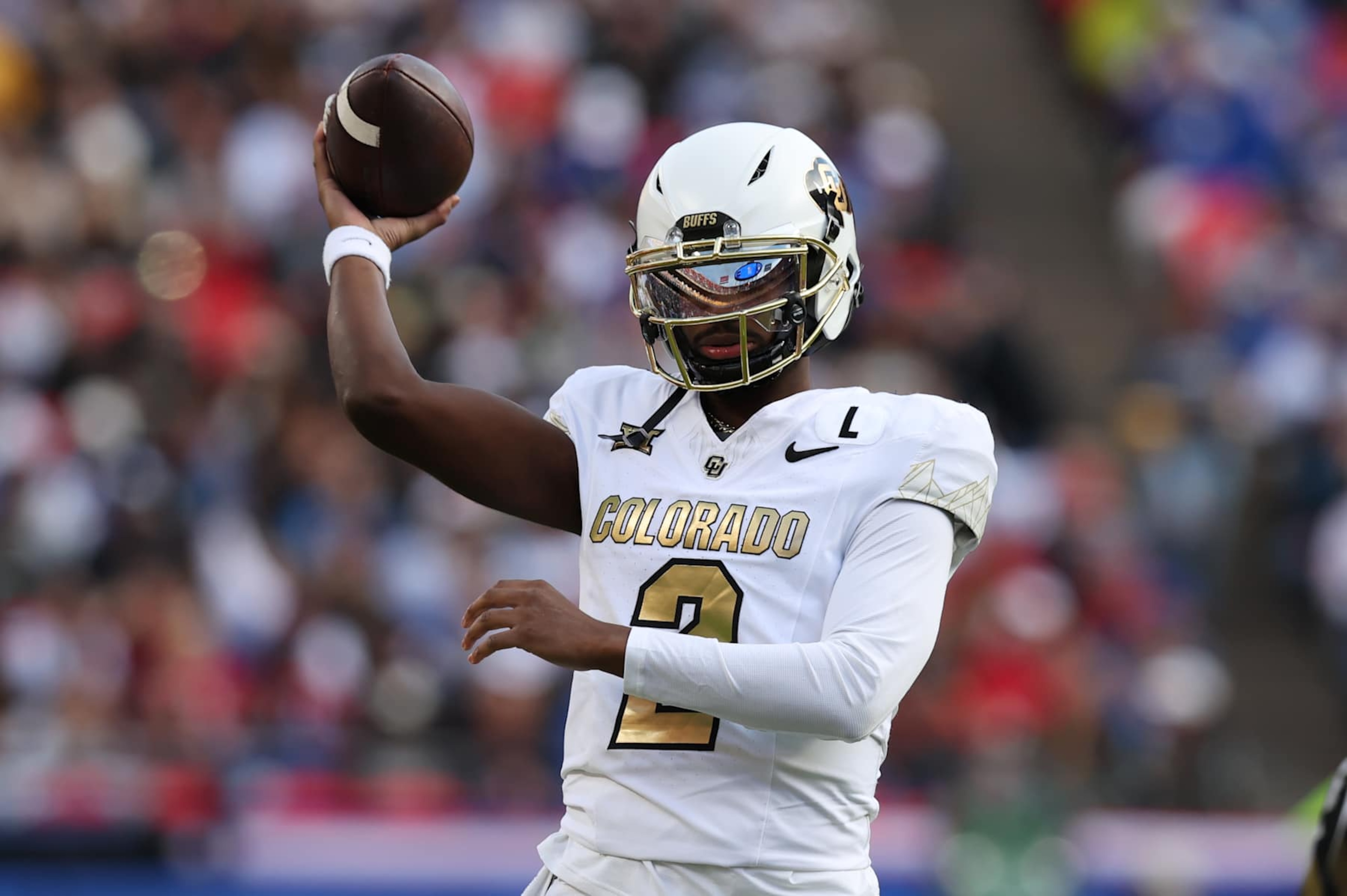 KANSAS CITY, MO - NOVEMBER 23: Colorado Buffaloes quarterback Shedeur Sanders (2) throws a warm up pass between drives in the second quarter of a Big 12 game between the Colorado Buffaloes and Kansas Jayhawks on November 23, 2024 at GEHA Field at Arrowhead Stadium in Kansas City, MO. (Photo by Scott Winters/Icon Sportswire via Getty Images) KANSAS CITY, MO - NOVEMBER 23: Colorado Buffaloes quarterback Shedeur Sanders (2) throws a warm up pass between drives in the second quarter of a Big 12 game between the Colorado Buffaloes and Kansas Jayhawks on November 23, 2024 at GEHA Field at Arrowhead Stadium in Kansas City, MO. (Photo by Scott Winters/Icon Sportswire via Getty Images)