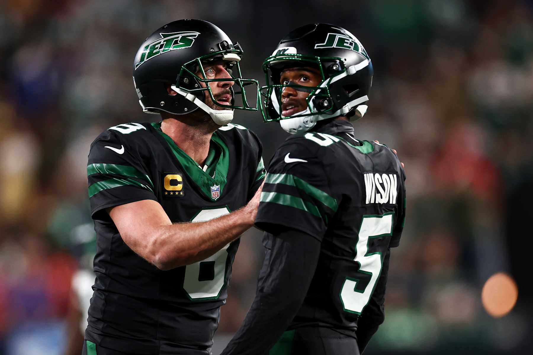 EAST RUTHERFORD, NEW JERSEY - OCTOBER 31: Aaron Rodgers #8 of the New York Jets celebrates with Garrett Wilson #5 after a touchdown during the second half of an NFL football game against the Houston Texans, at MetLife Stadium on October 31, 2024 in East Rutherford, New Jersey. (Photo by Kevin Sabitus/Getty Images)