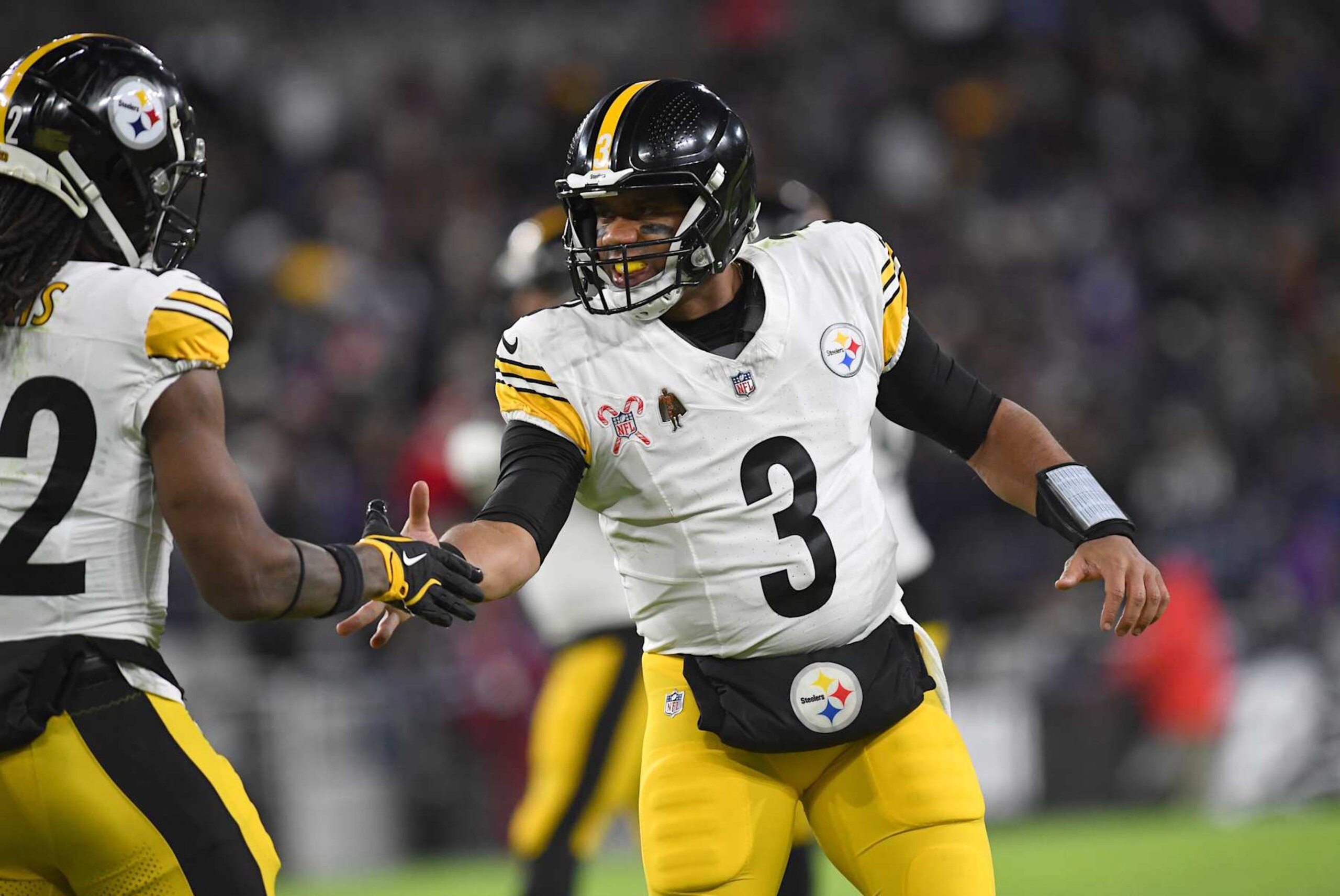 BALTIMORE, MD - DECEMBER 21: Steelers quarterback Russell Wilson (3) celebrates with running back Najee Harris (22) after throwing a touchdown pass during the Pittsburgh Steelers versus Baltimore Ravens NFL game at M&T Bank Stadium on December 21, 2024 in Baltimore, MD. (Photo by Randy Litzinger/Icon Sportswire via Getty Images)