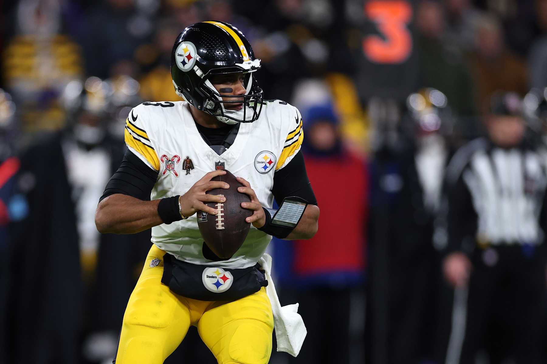 BALTIMORE, MARYLAND - DECEMBER 21: Russell Wilson #3 of the Pittsburgh Steelers looks to pass during the second quarter against the Baltimore Ravens at M&T Bank Stadium on December 21, 2024 in Baltimore, Maryland. (Photo by Patrick Smith/Getty Images)